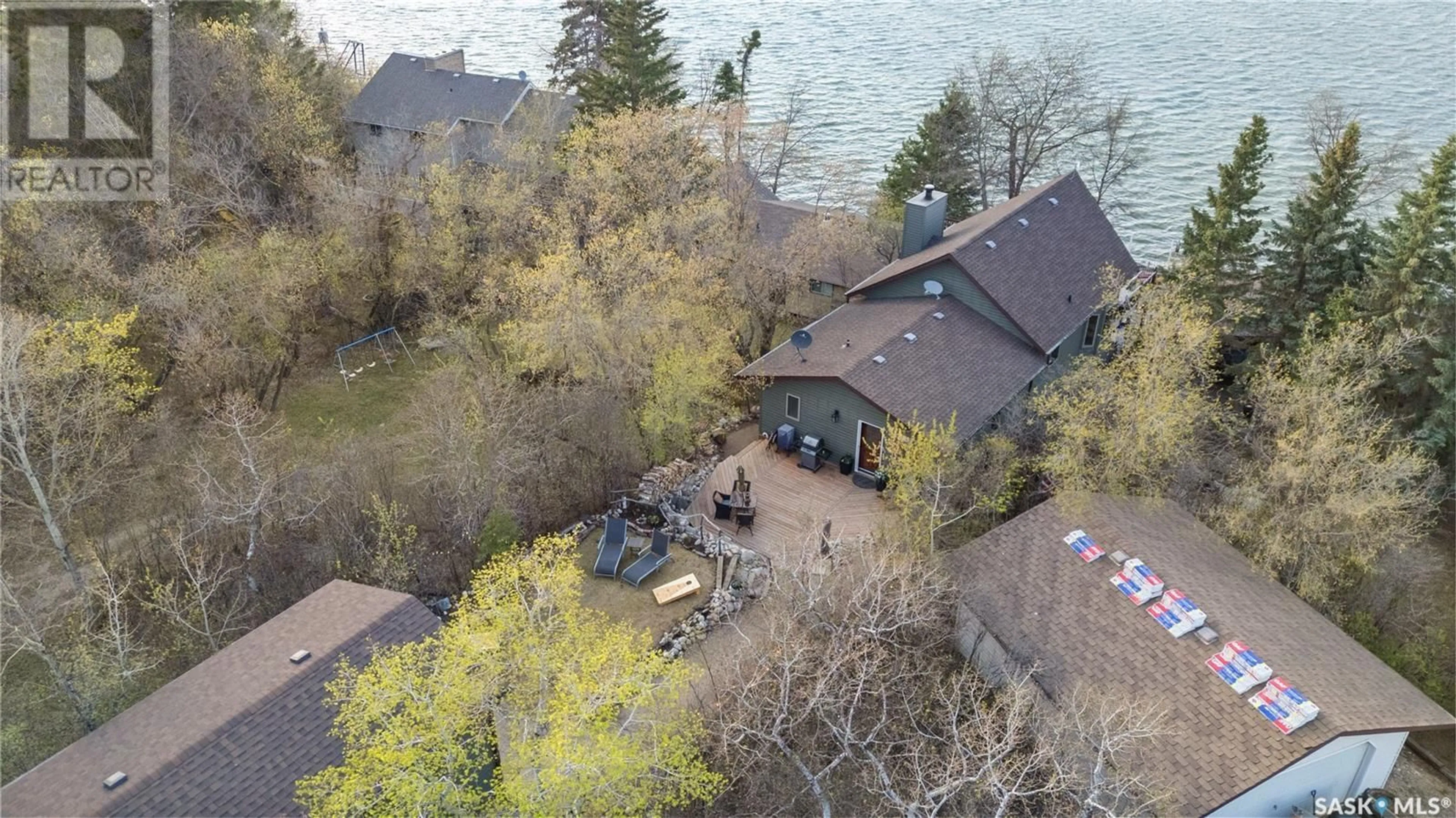 A pic from outside/outdoor area/front of a property/back of a property/a pic from drone, water/lake/river/ocean view for 97 BYNG AVENUE, Wakaw Lake Saskatchewan S0K4P0