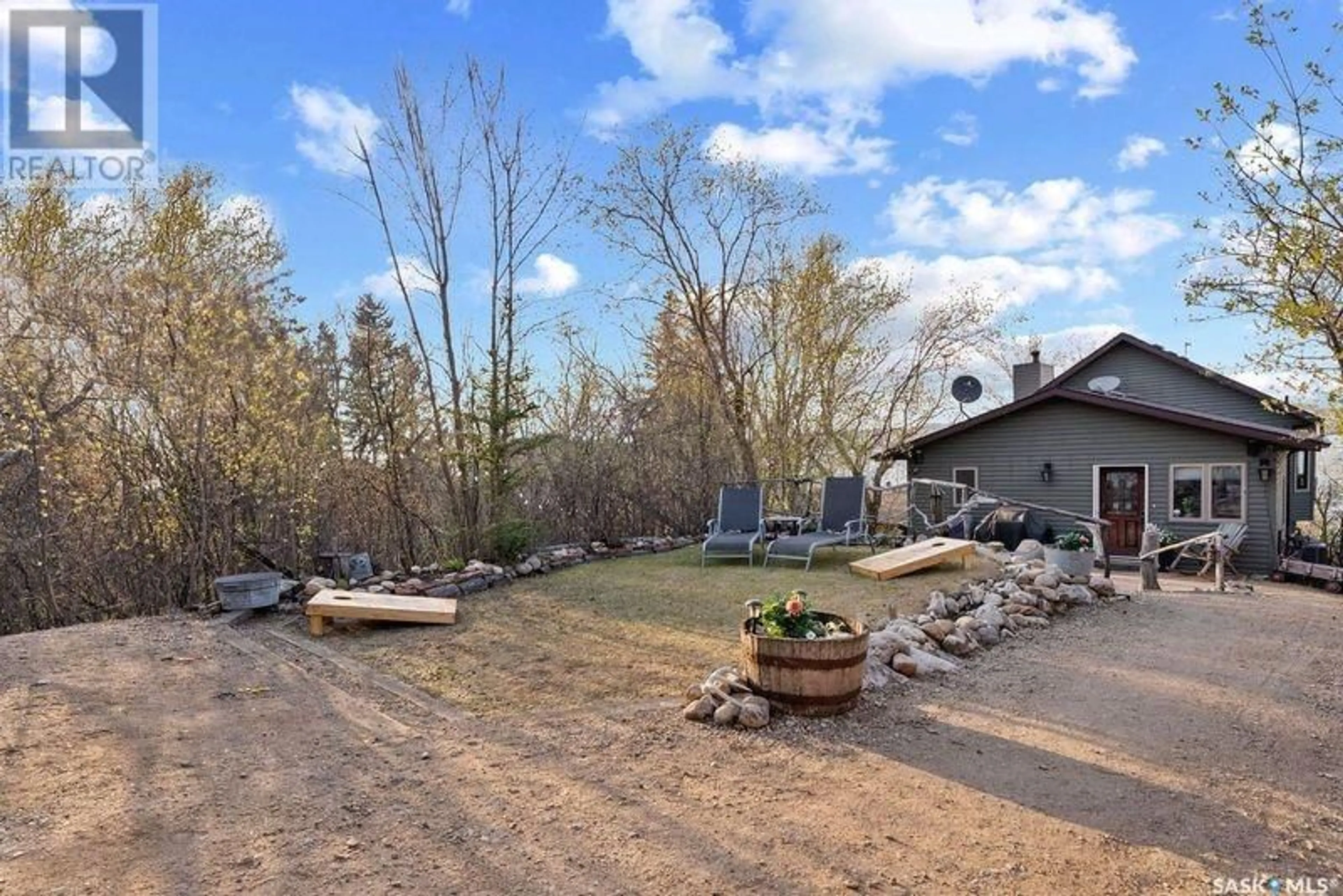 A pic from outside/outdoor area/front of a property/back of a property/a pic from drone, water/lake/river/ocean view for 97 BYNG AVENUE, Wakaw Lake Saskatchewan S0K4P0