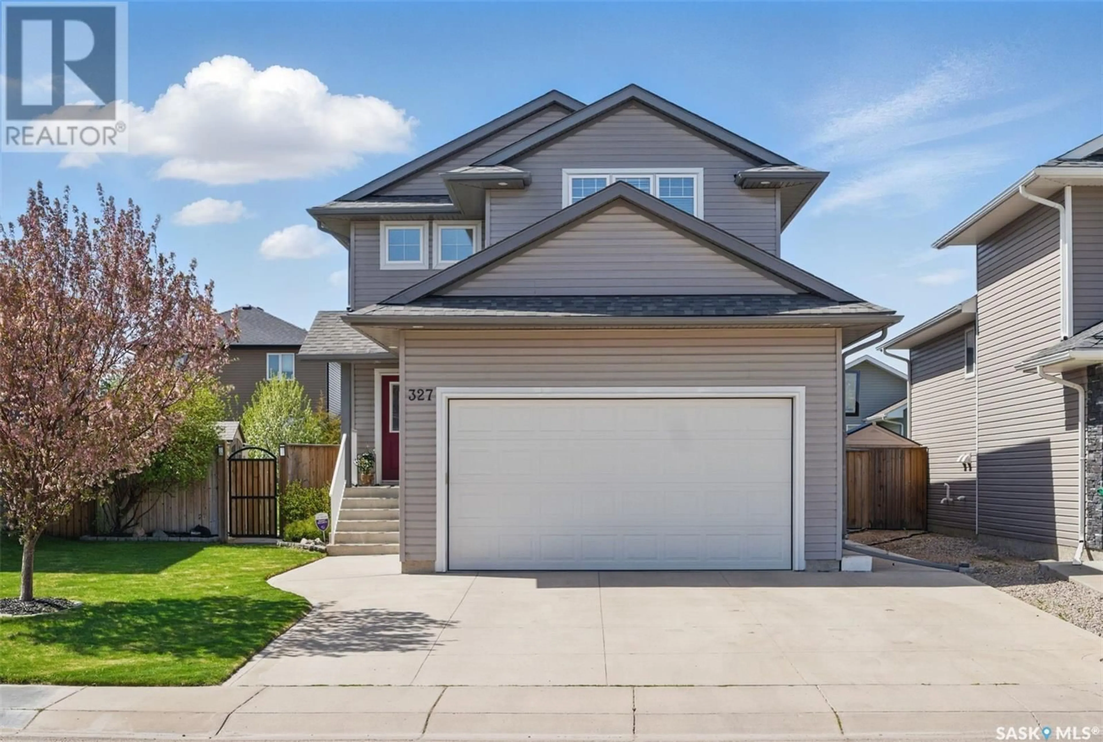 Home with vinyl exterior material, street for 327 MCCALLUM LANE, Saskatoon Saskatchewan S7R0J3