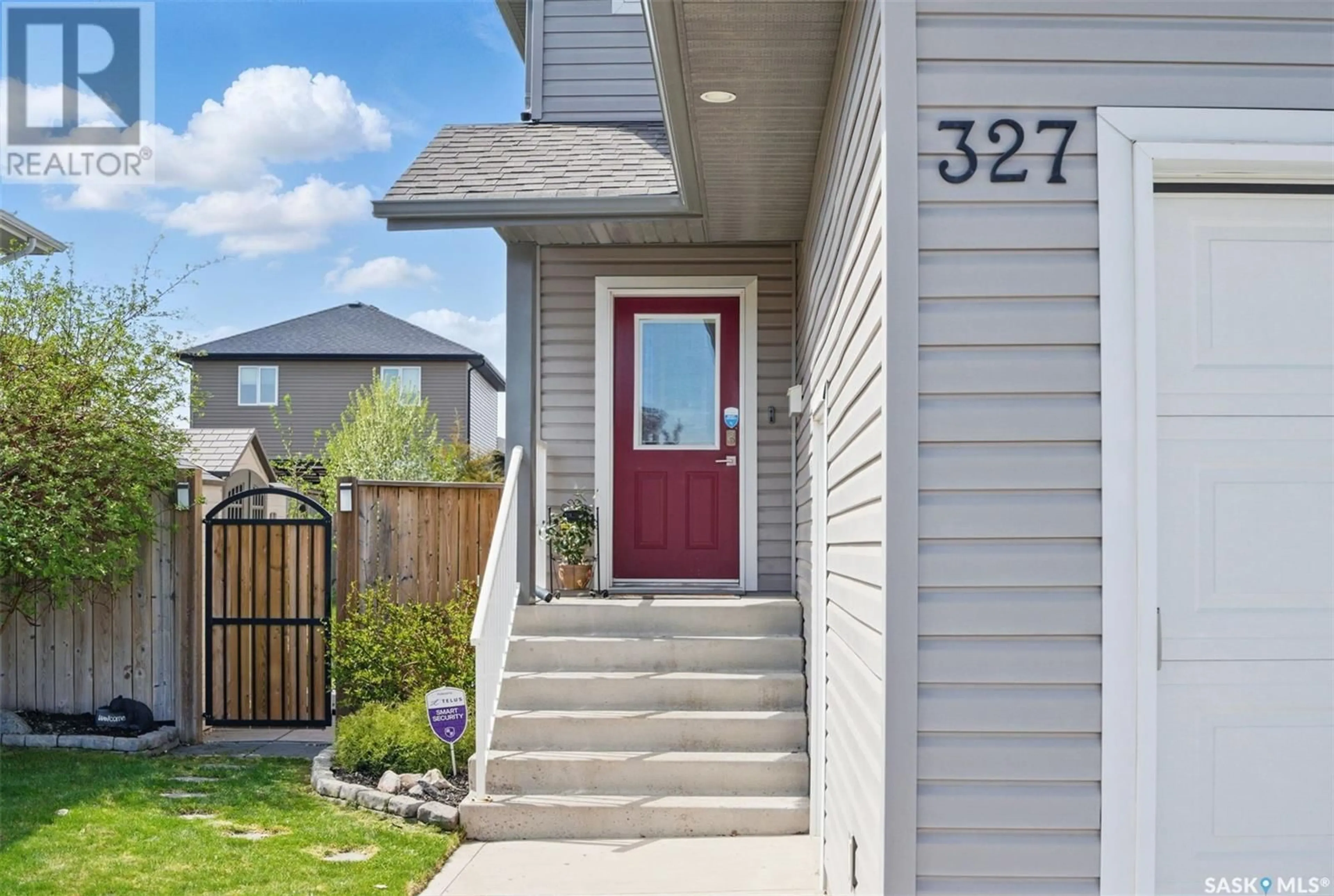 Home with vinyl exterior material, street for 327 MCCALLUM LANE, Saskatoon Saskatchewan S7R0J3