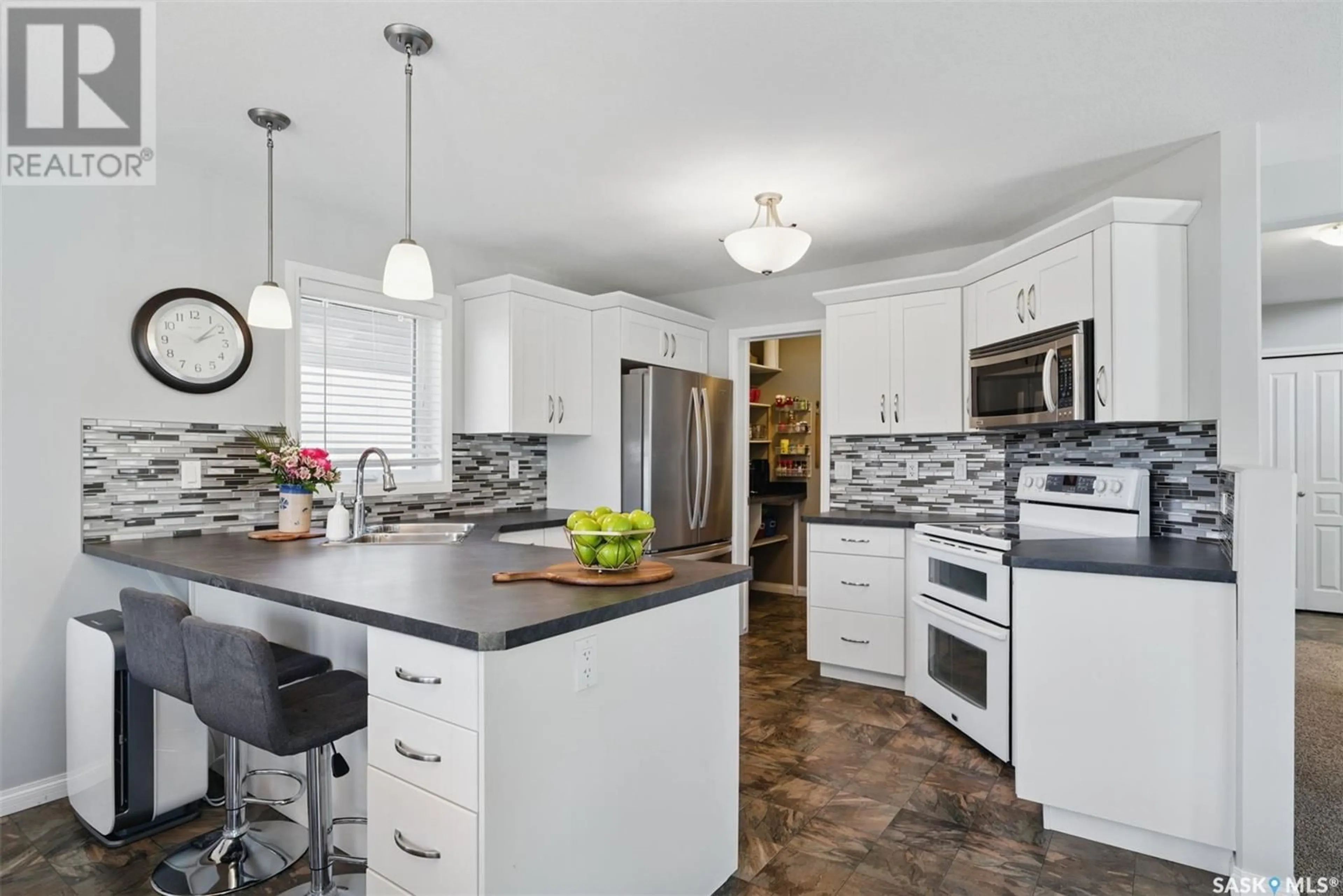Open concept kitchen, ceramic/tile floor for 327 MCCALLUM LANE, Saskatoon Saskatchewan S7R0J3