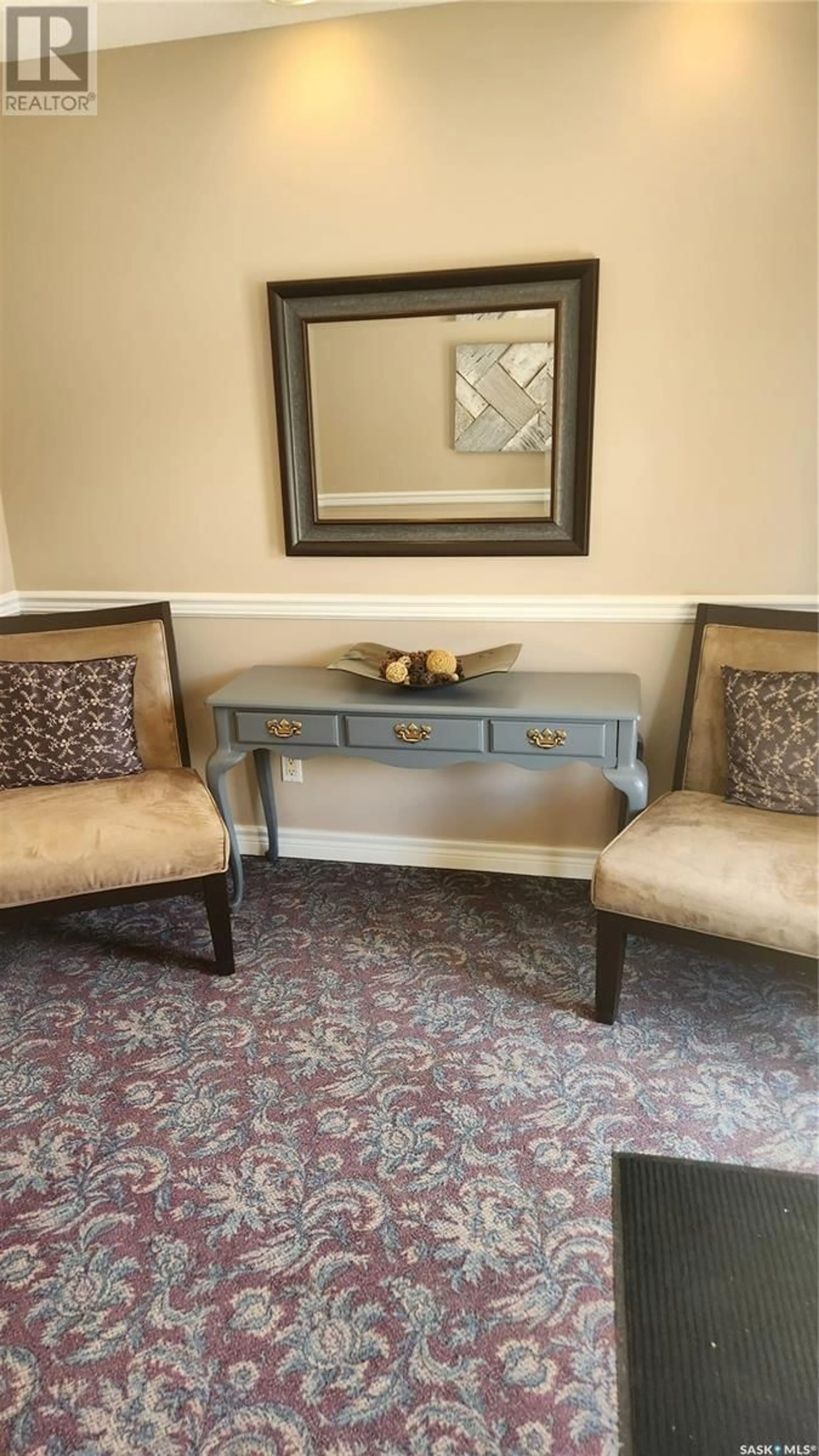 Living room with furniture, carpet floor for E - 105 240 ATHABASCA STREET, Moose Jaw Saskatchewan S6H0L5