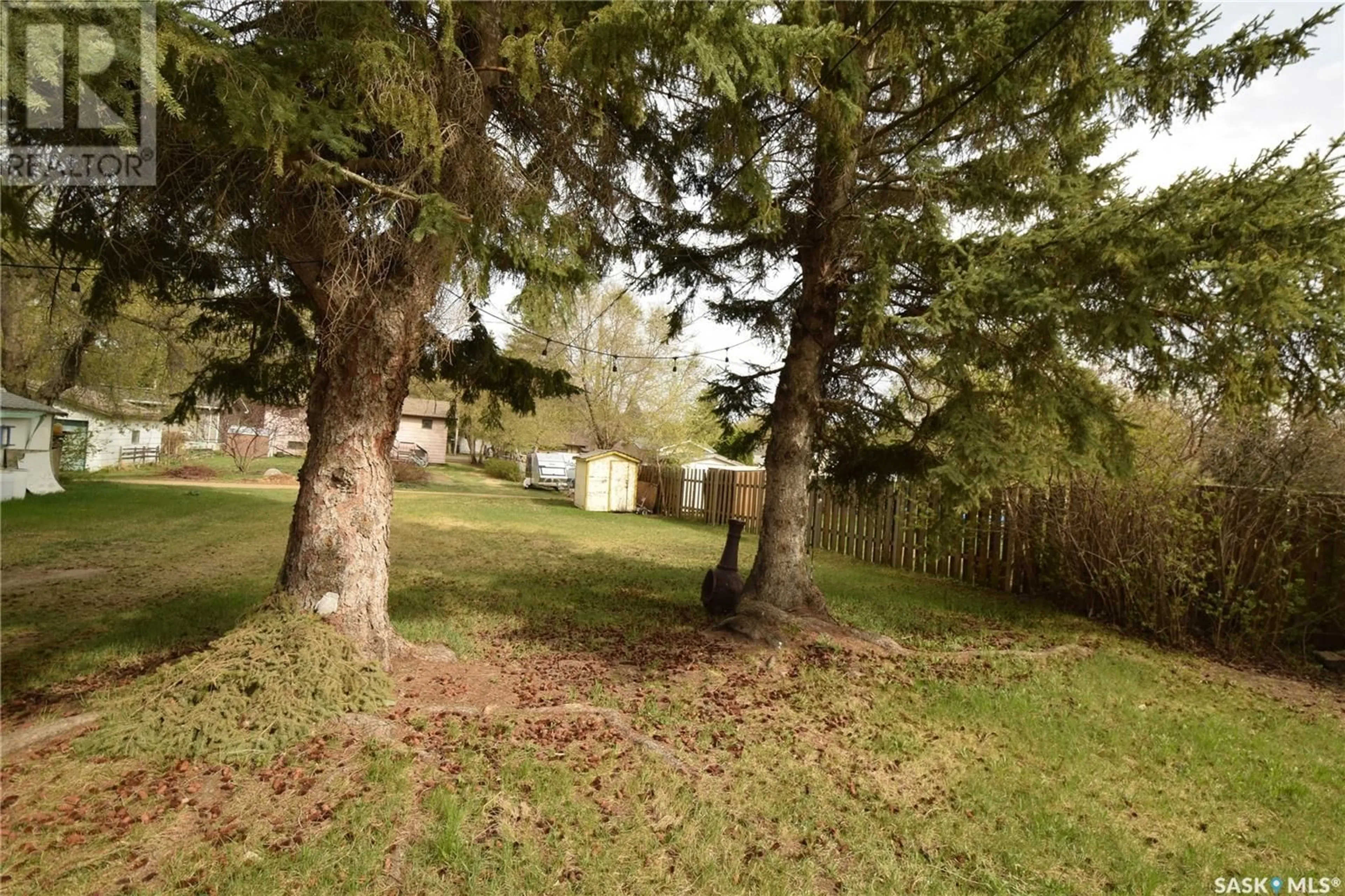 A pic from outside/outdoor area/front of a property/back of a property/a pic from drone, forest/trees view for 606 4TH AVENUE, Cudworth Saskatchewan S0K1B0