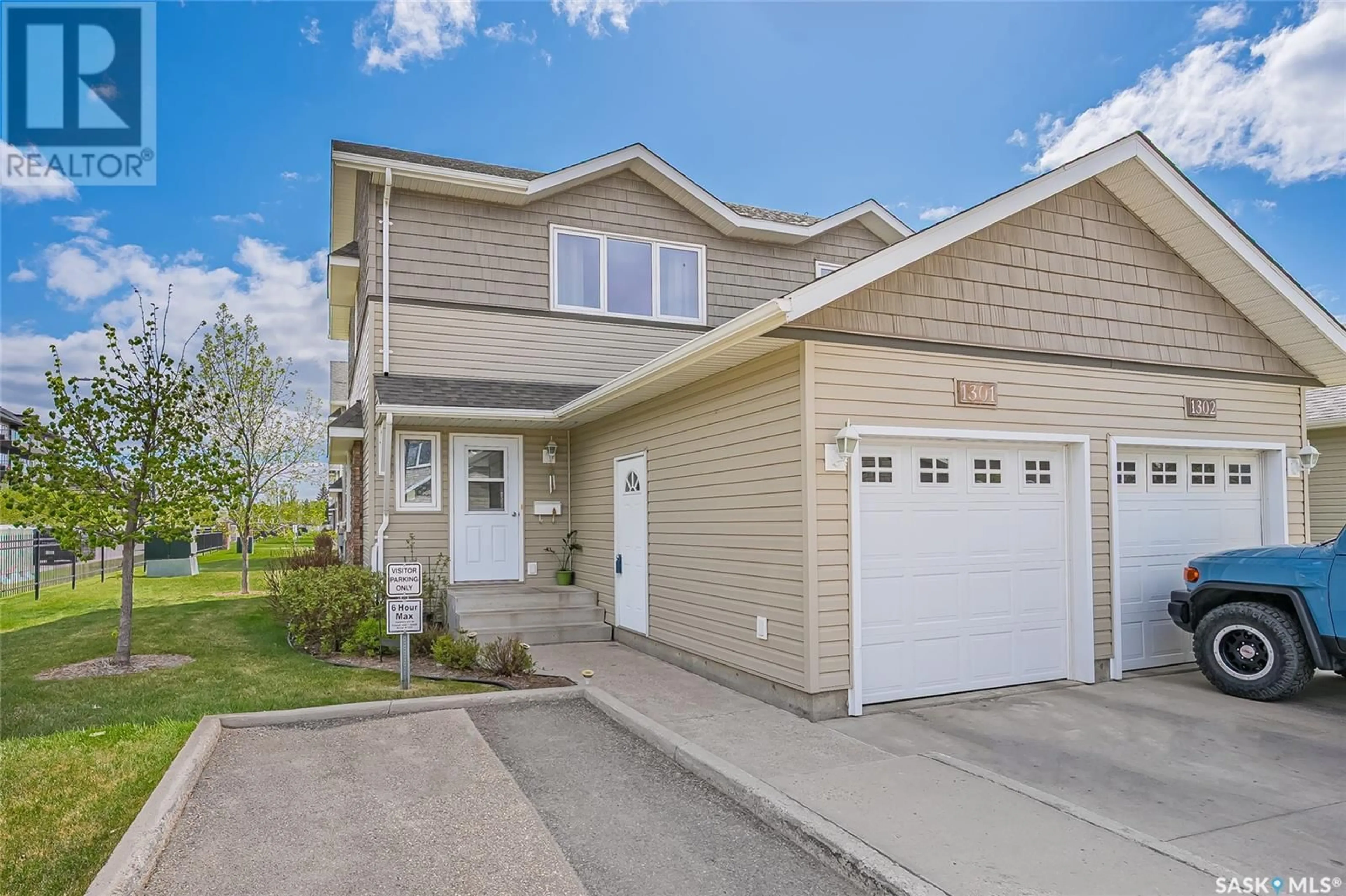 Home with vinyl exterior material, street for 715 - 1301 HART ROAD, Saskatoon Saskatchewan S7M3Y9