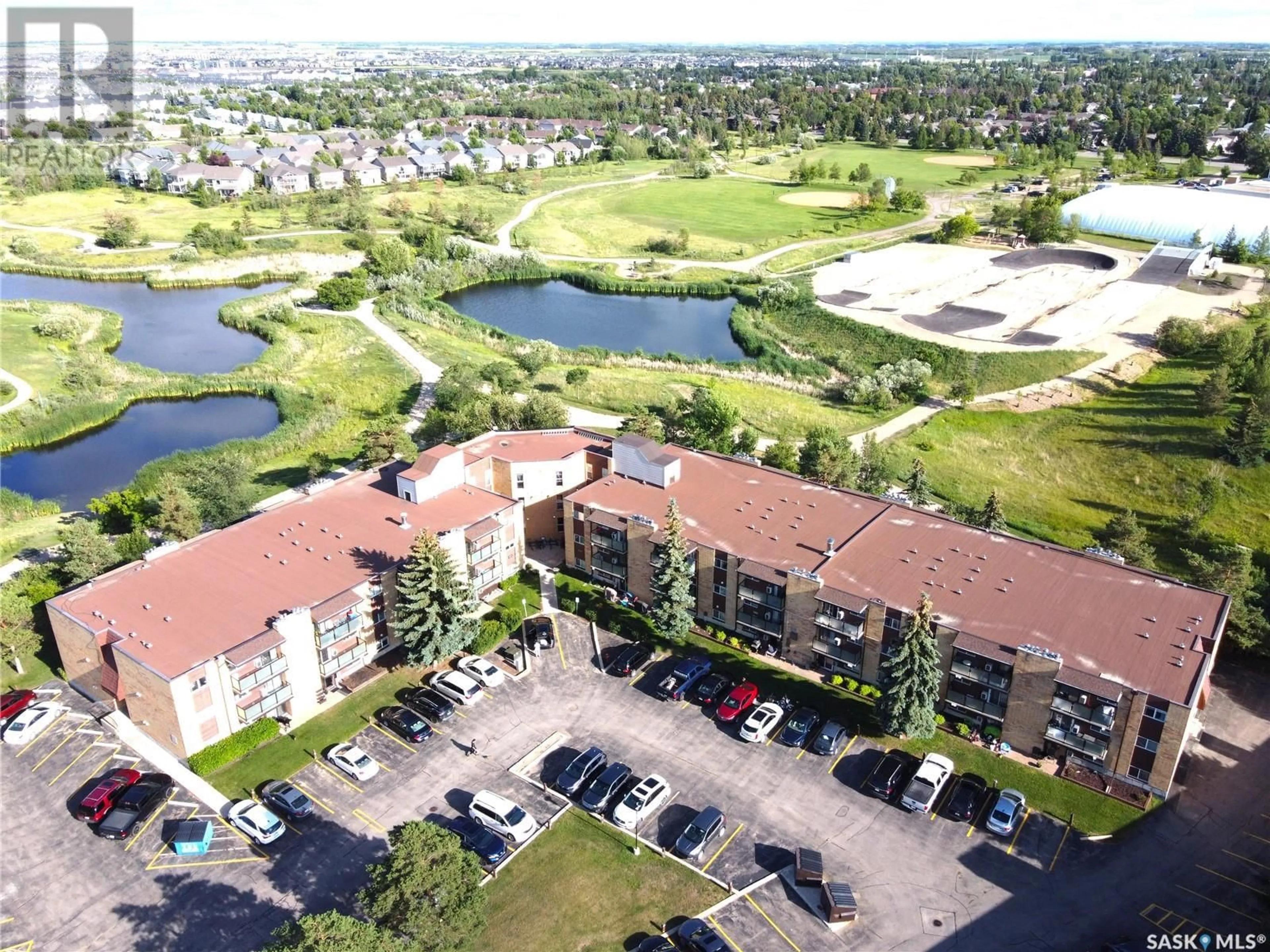 A pic from outside/outdoor area/front of a property/back of a property/a pic from drone, water/lake/river/ocean view for 301 419 TAIT COURT, Saskatoon Saskatchewan S7H5L3