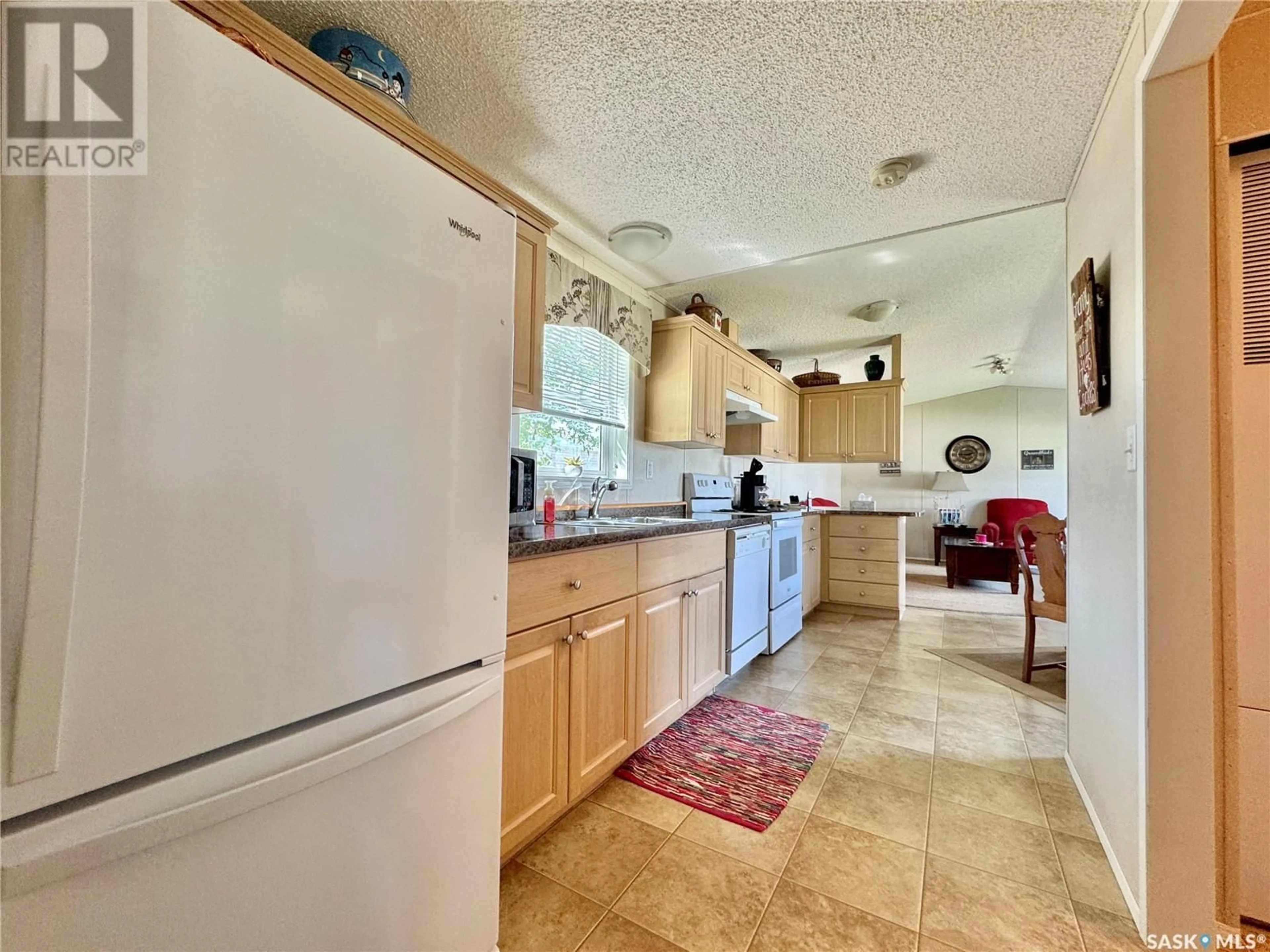 Standard kitchen, ceramic/tile floor for E - 311 RIEDEL AVENUE, Langenburg Saskatchewan S0A2A0