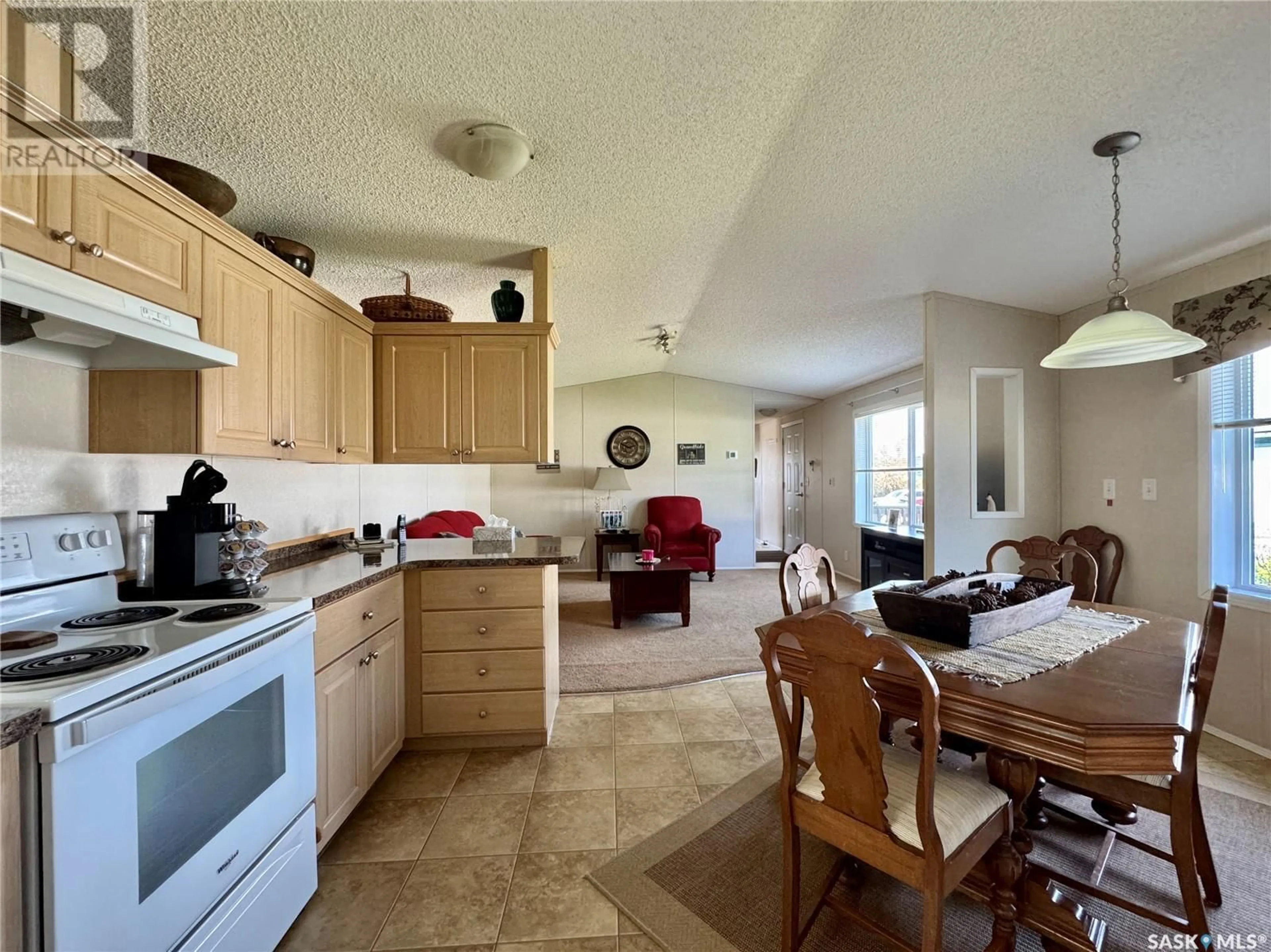Open concept kitchen, ceramic/tile floor for E - 311 RIEDEL AVENUE, Langenburg Saskatchewan S0A2A0