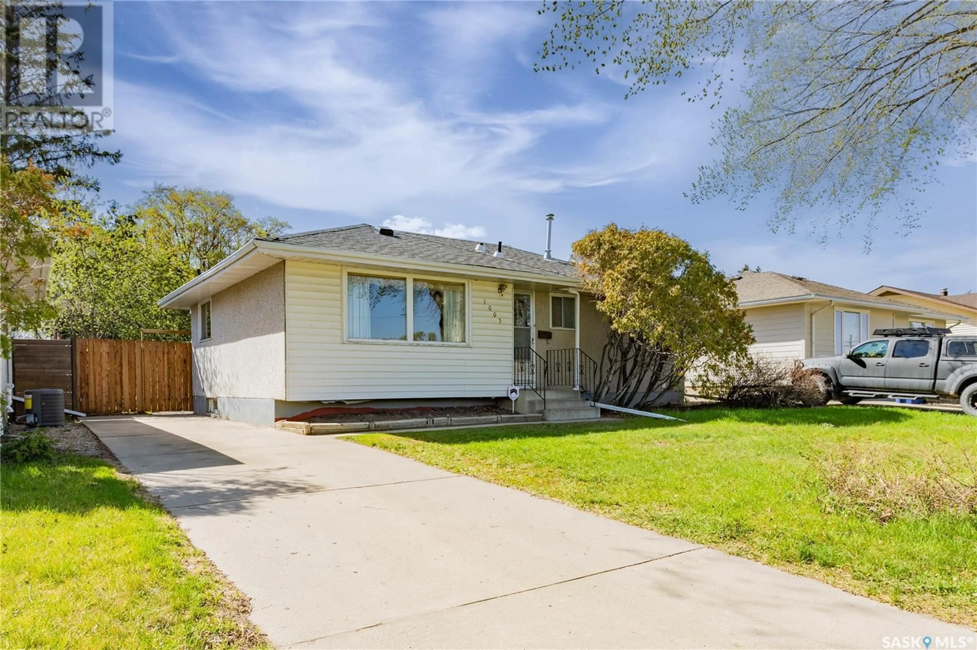 Home with vinyl exterior material, street for 1005 MCMILLAN AVENUE, Saskatoon Saskatchewan S7L2T9