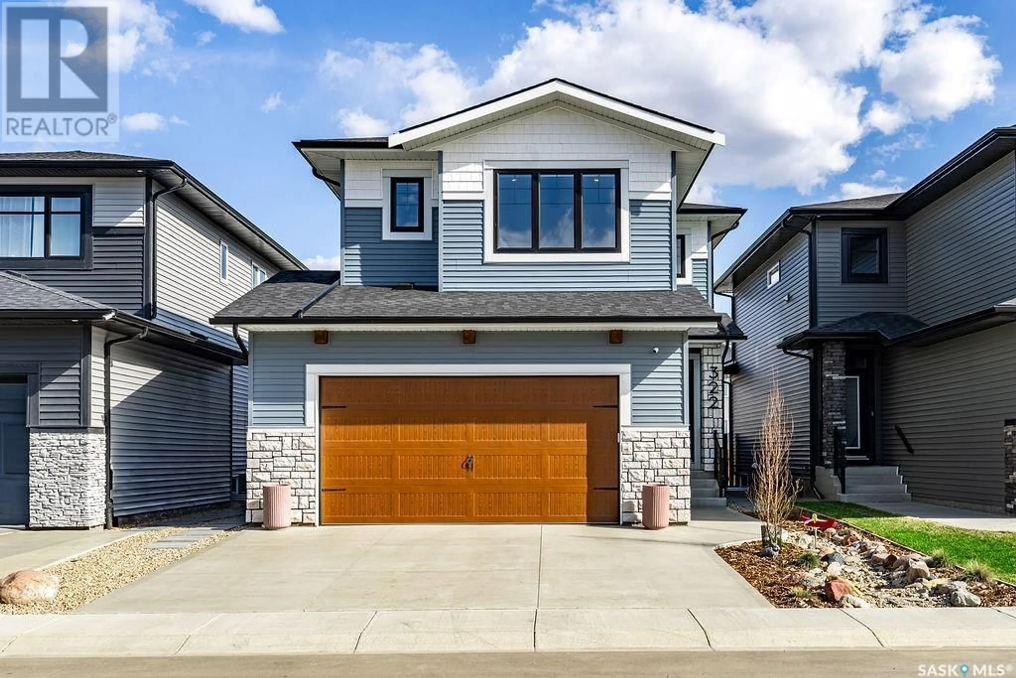 Home with brick exterior material, street for 322 ANISKOTAW BEND, Saskatoon Saskatchewan S7V1L9