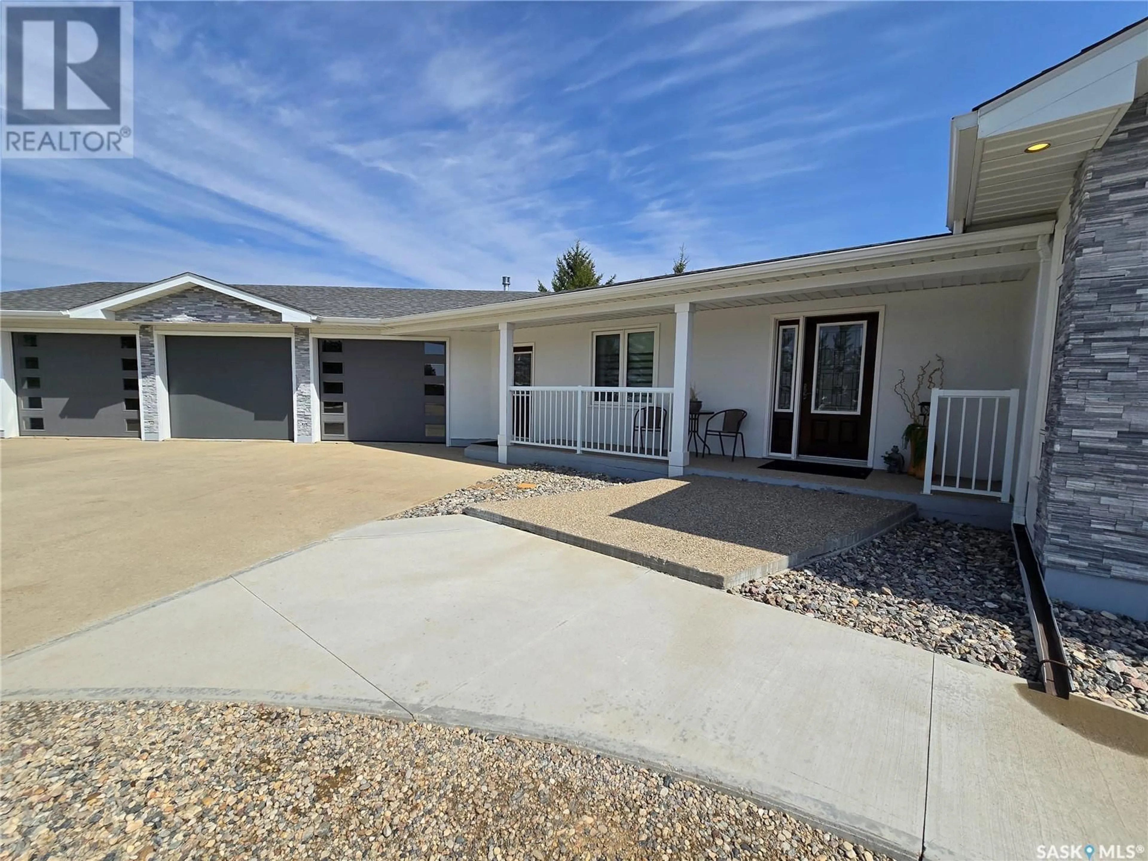 Home with vinyl exterior material, street for 915 COTEAU AVENUE, Weyburn Saskatchewan S4H2T9
