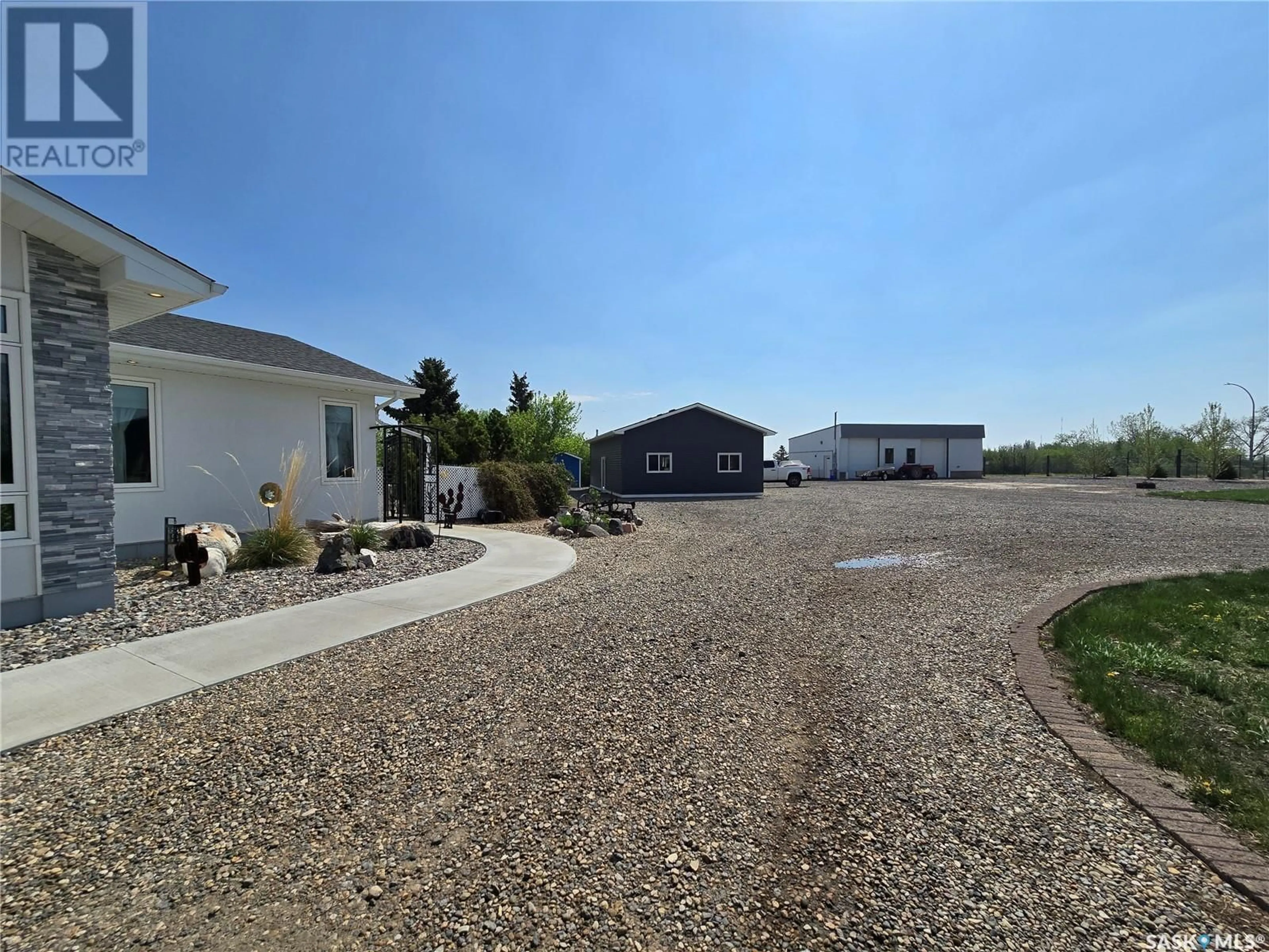 A pic from outside/outdoor area/front of a property/back of a property/a pic from drone, unknown for 915 COTEAU AVENUE, Weyburn Saskatchewan S4H2T9