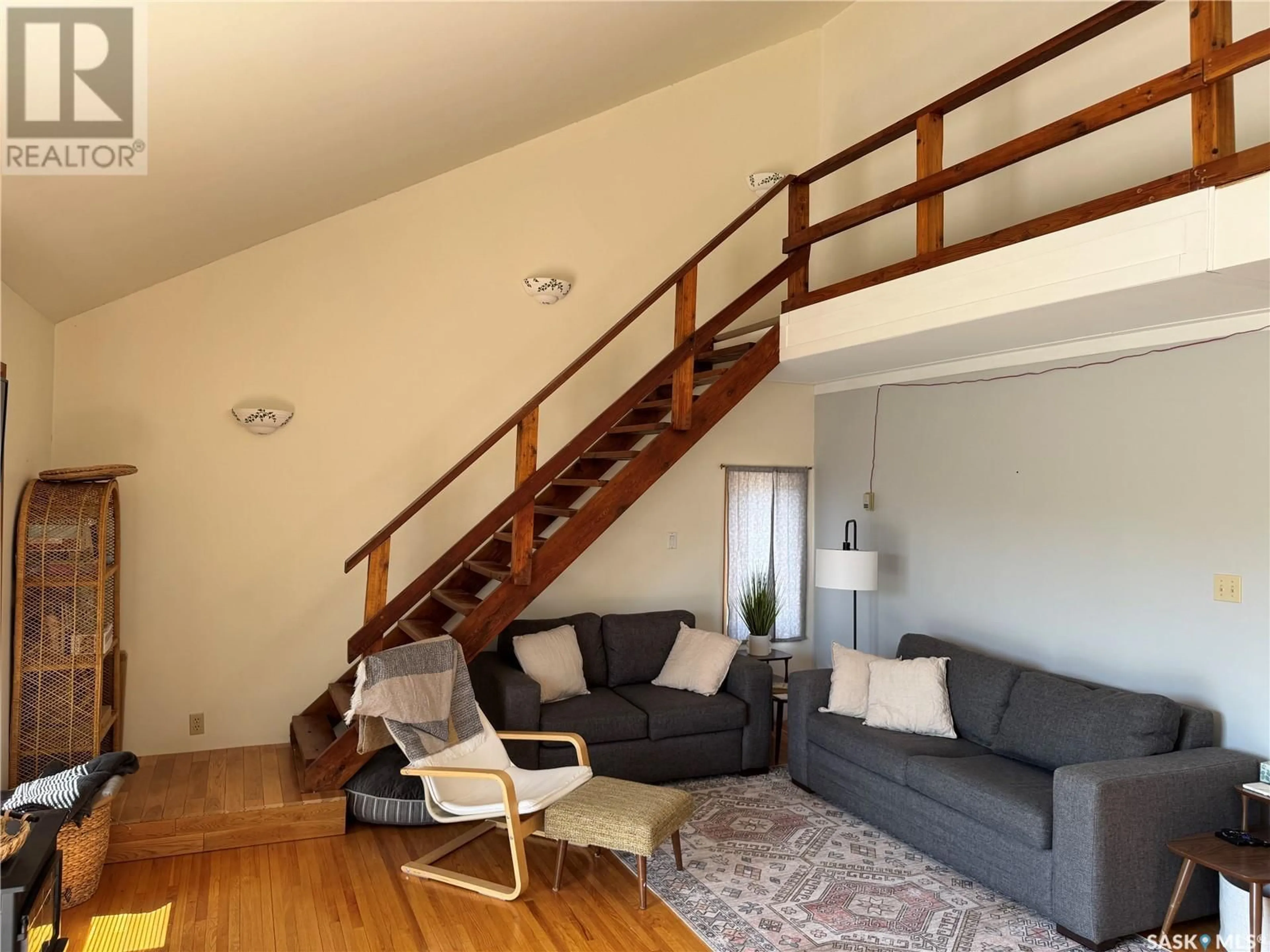 Living room with furniture, wood/laminate floor for 133 PEBBLE BEACH ROAD, Good Spirit Acres Saskatchewan S0A0L1