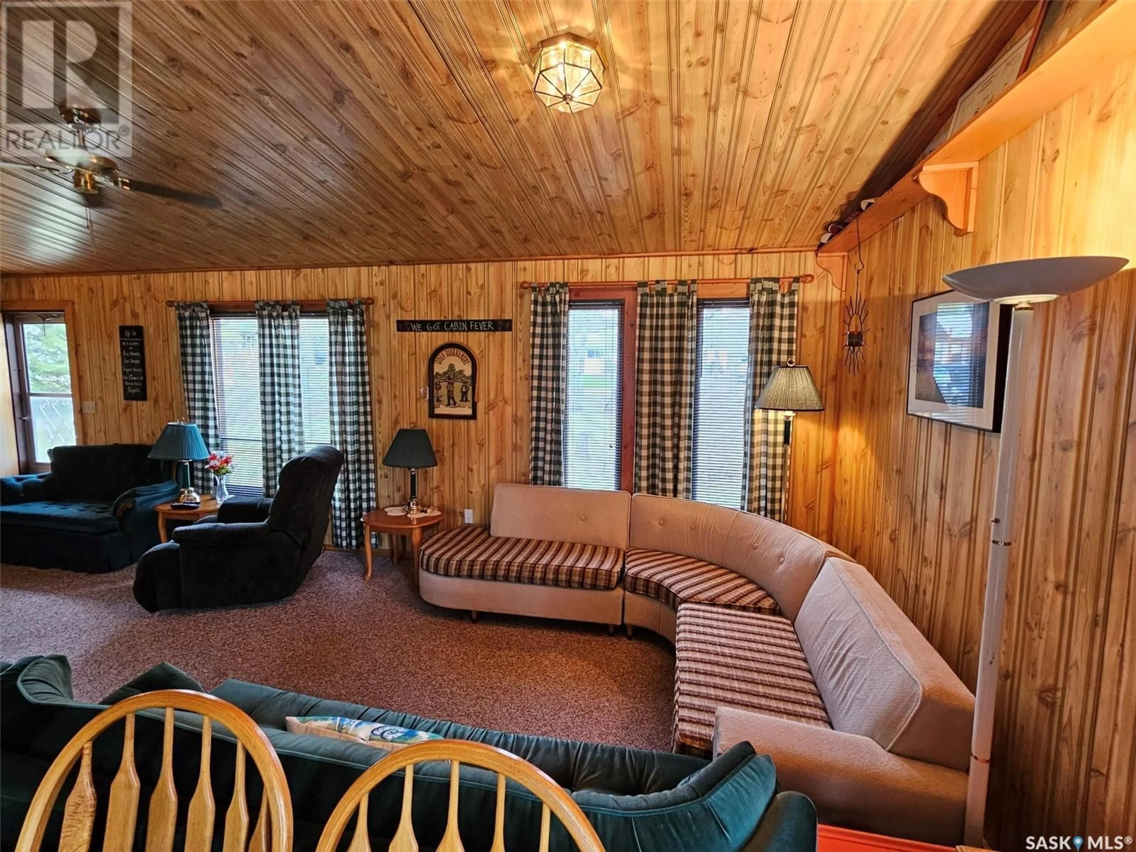 Living room with furniture, wood/laminate floor for 13 CENTENNIAL CRESCENT, Moose Mountain Provincial Park Saskatchewan S0C2S0