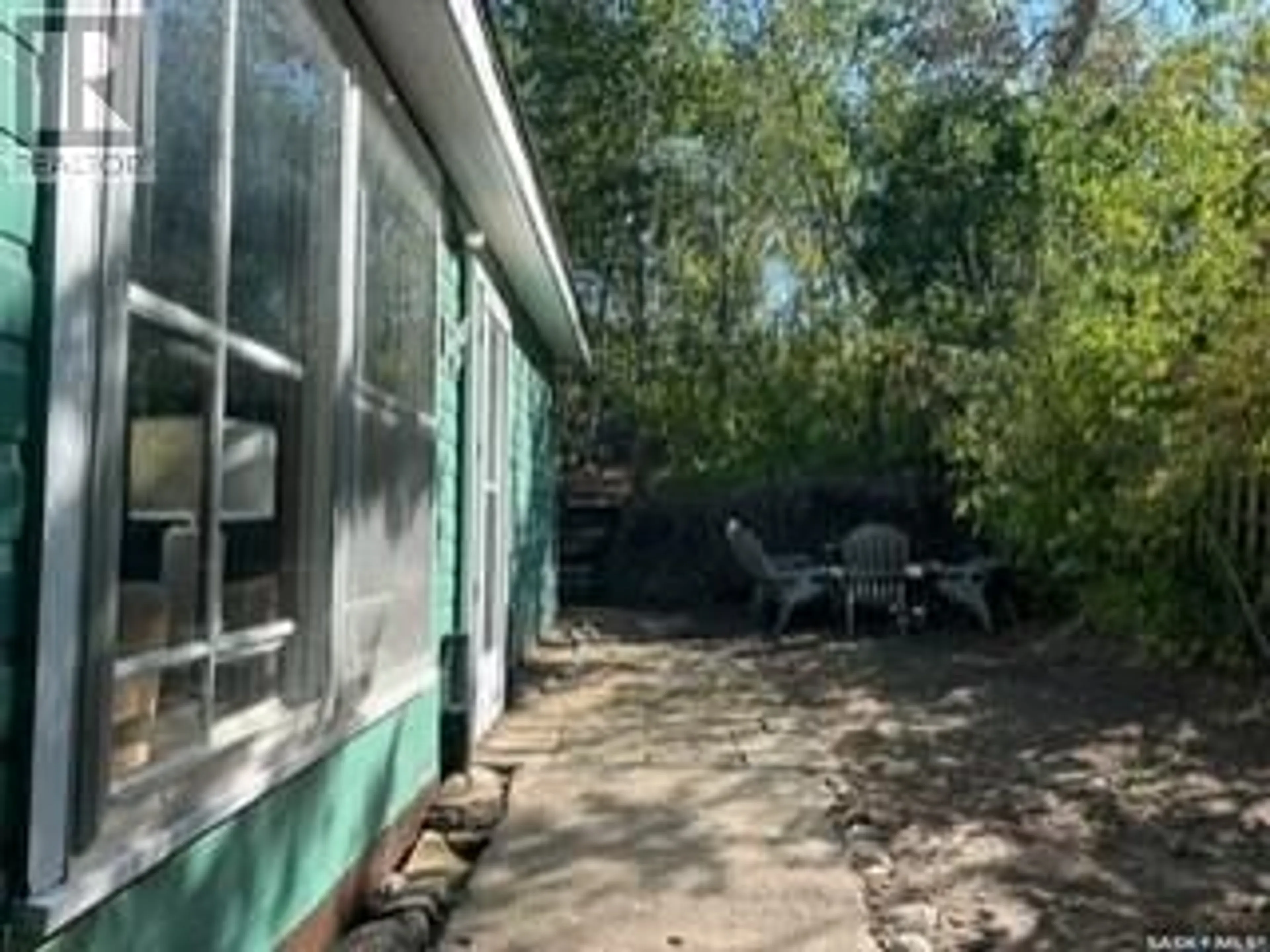 Patio, forest/trees view for 510 OSBORNE LANE, Regina Beach Saskatchewan S0G4C0