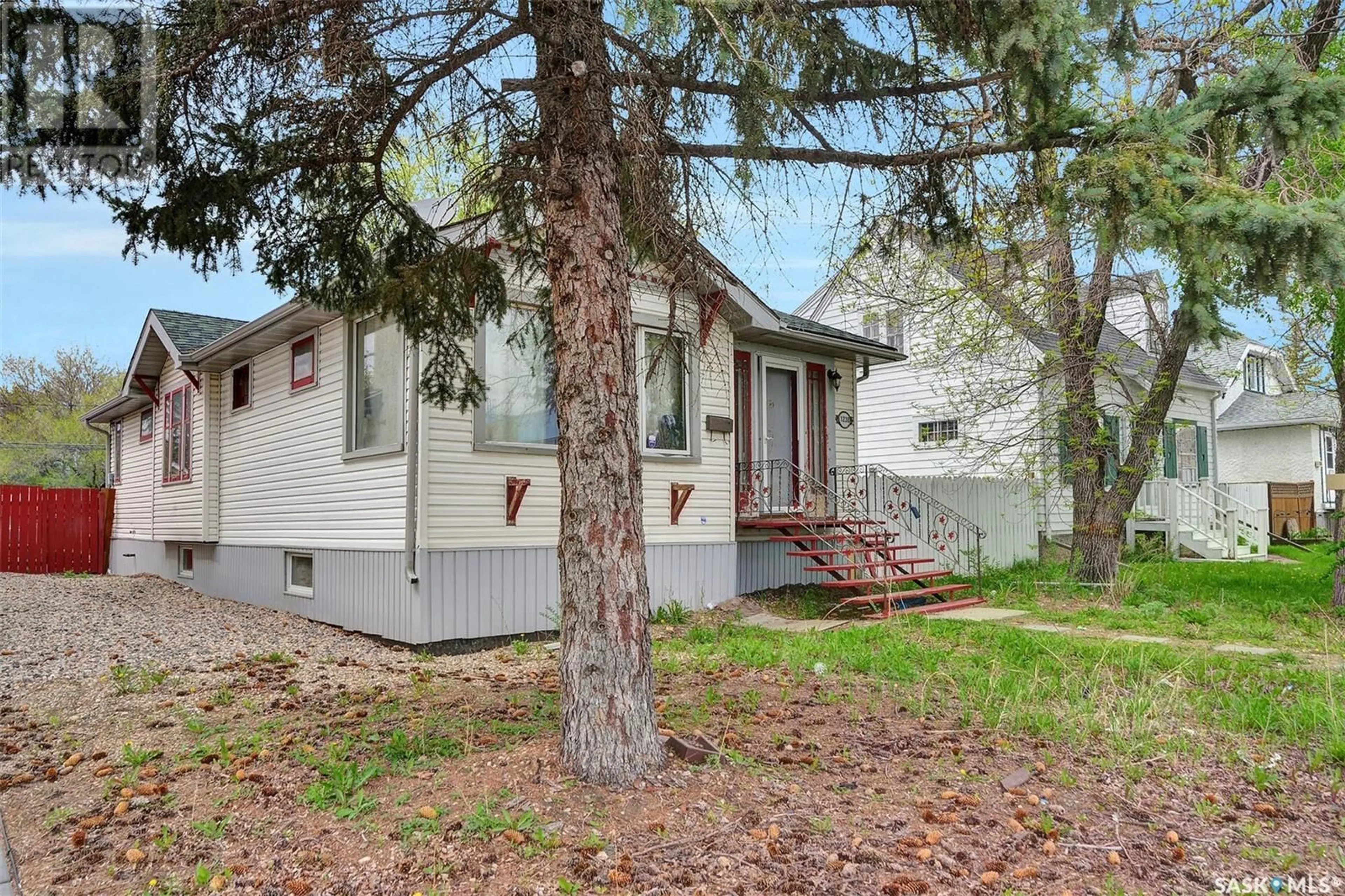 Home with vinyl exterior material, street for 1238 ELPHINSTONE STREET, Regina Saskatchewan S4T3M3