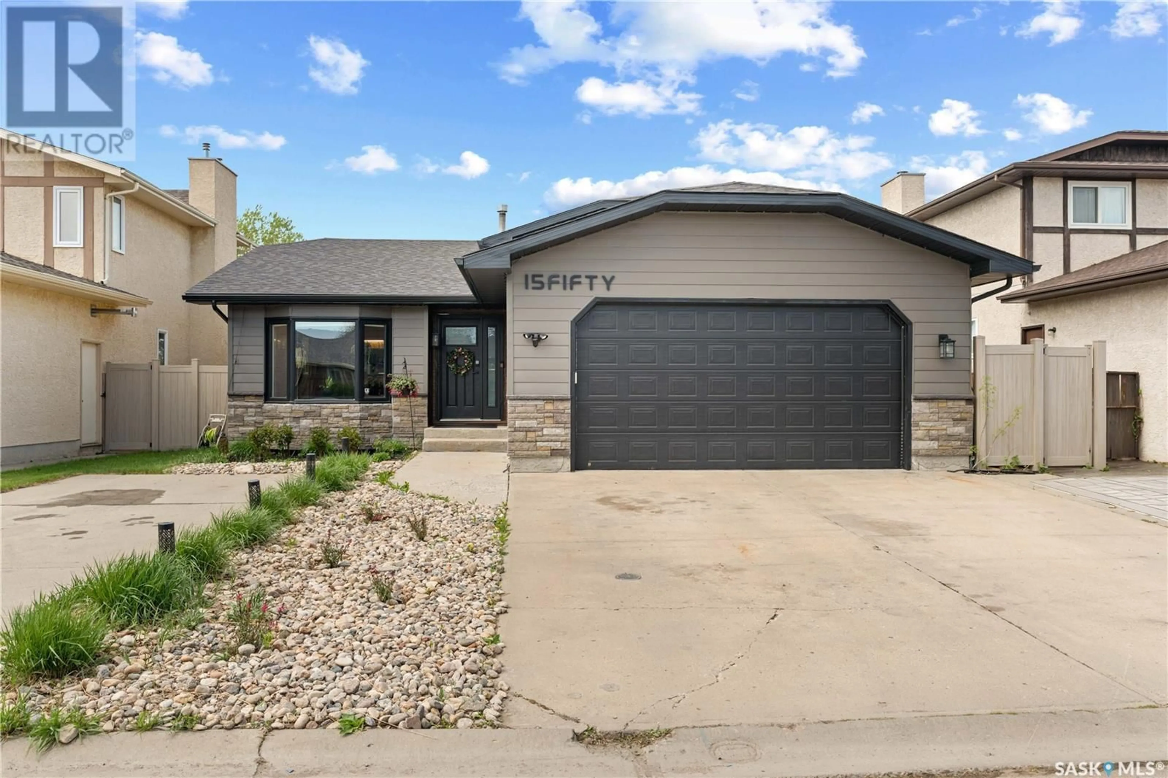 Home with brick exterior material, street for N - 1550 MCDERMID BAY, Regina Saskatchewan S4Z3Z4