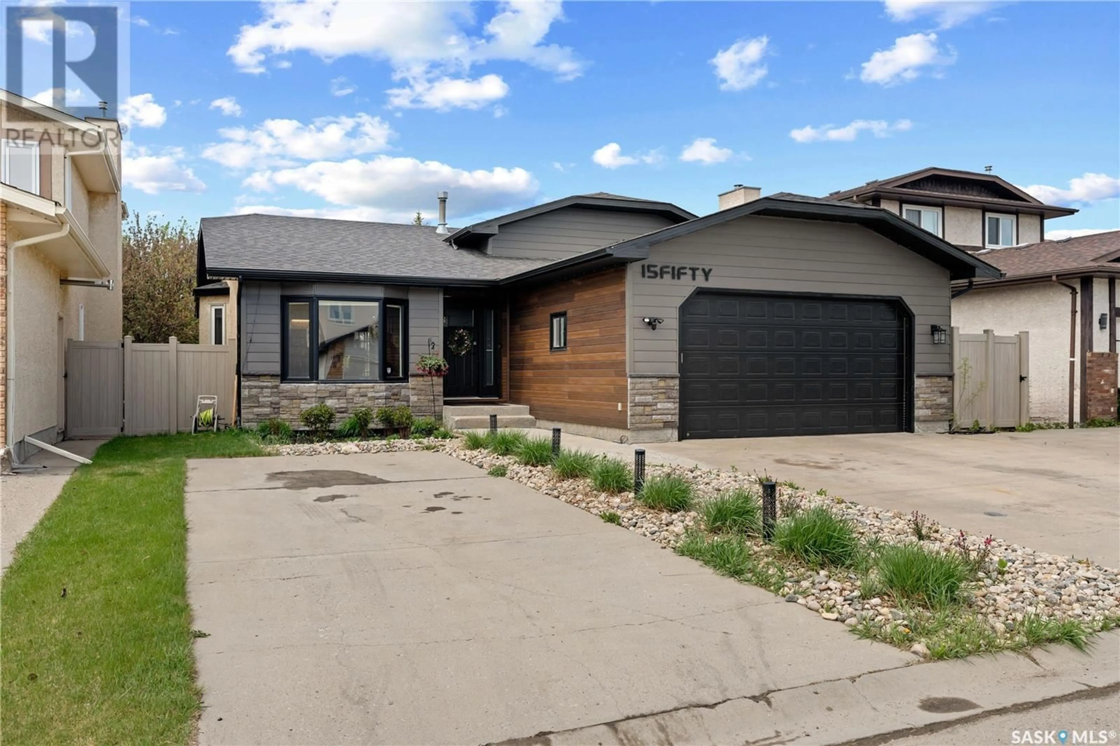 Home with brick exterior material, street for N - 1550 MCDERMID BAY, Regina Saskatchewan S4Z3Z4