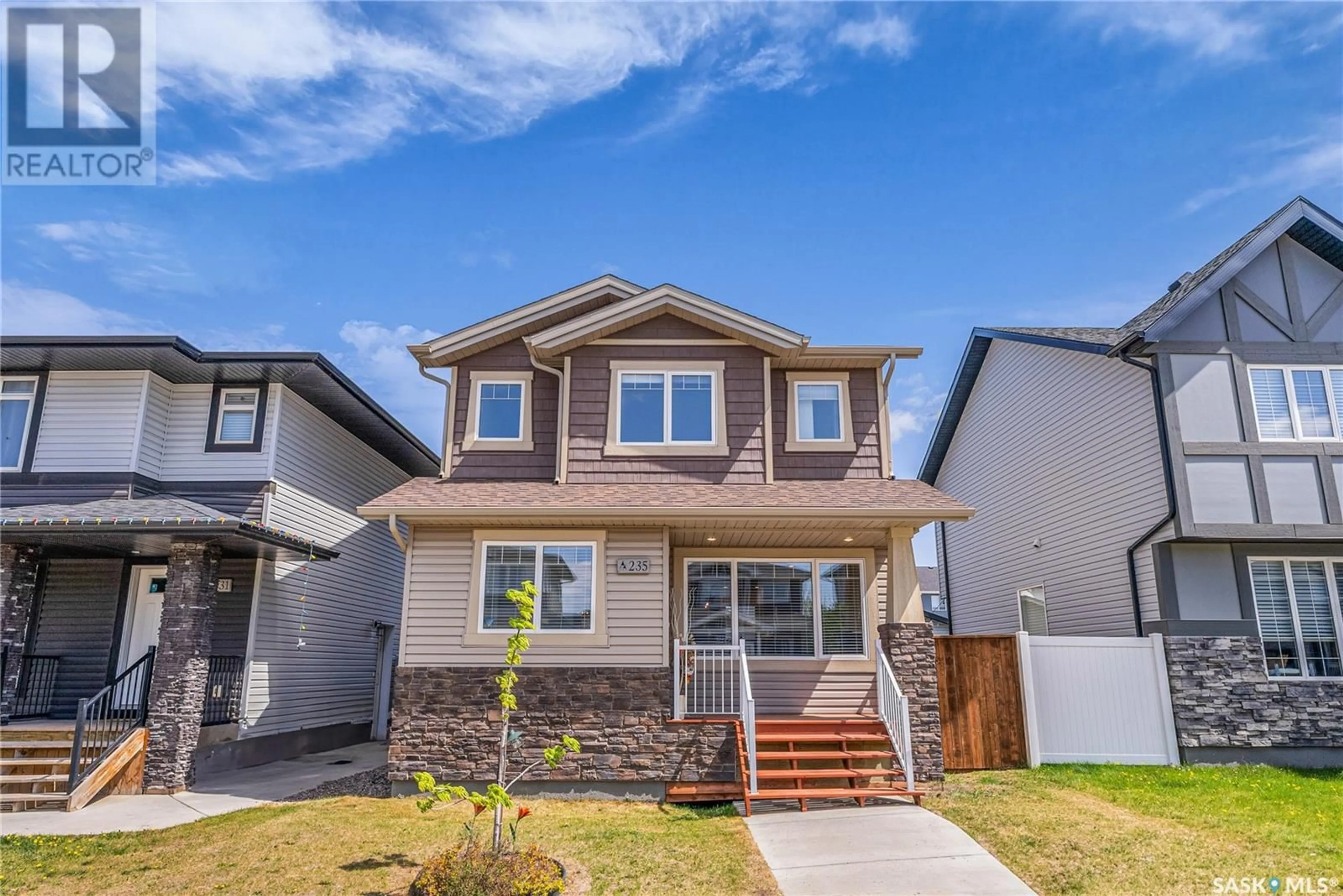 Home with vinyl exterior material, street for 235 SECORD WAY, Saskatoon Saskatchewan S7V0L9