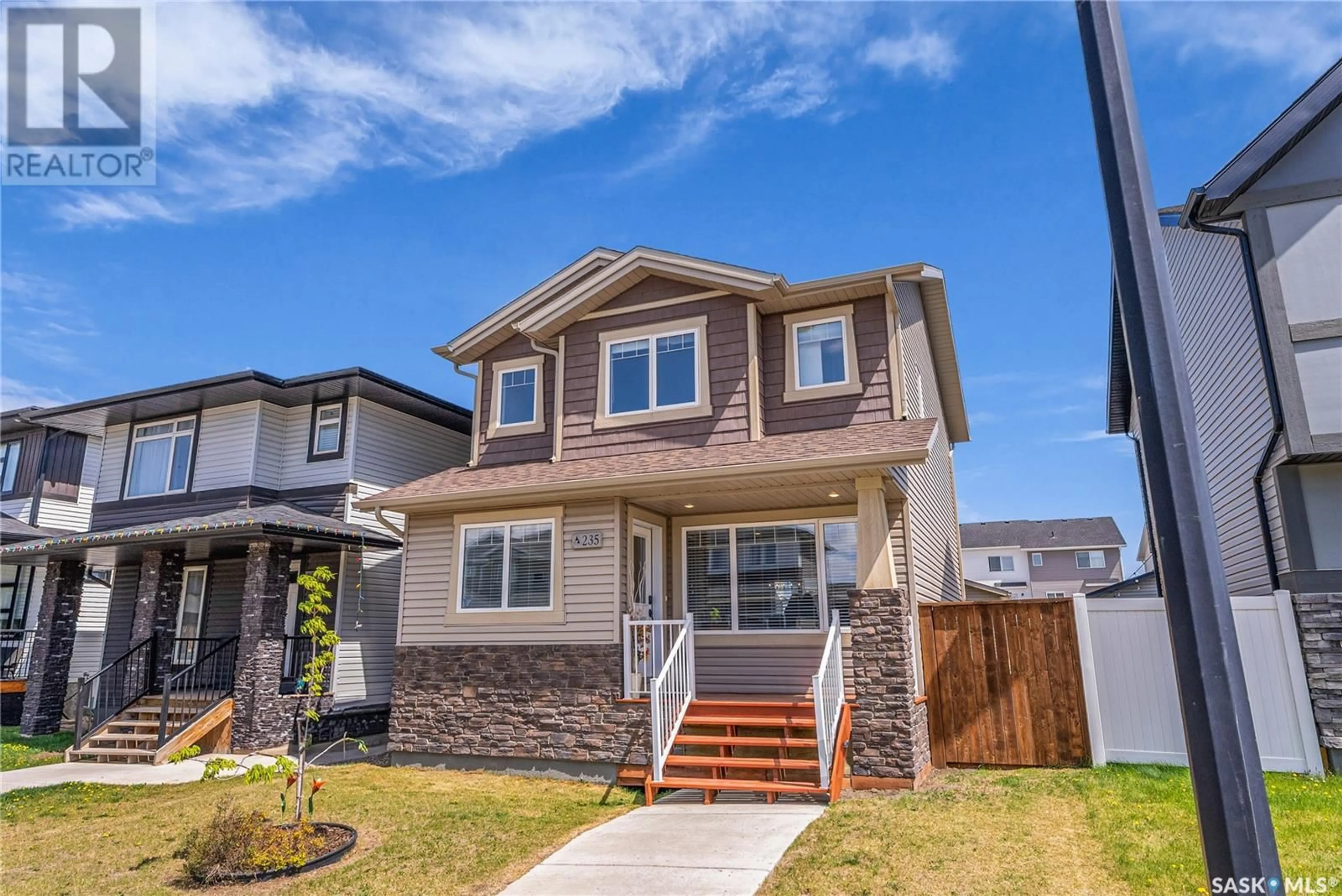 Home with vinyl exterior material, street for 235 SECORD WAY, Saskatoon Saskatchewan S7V0L9