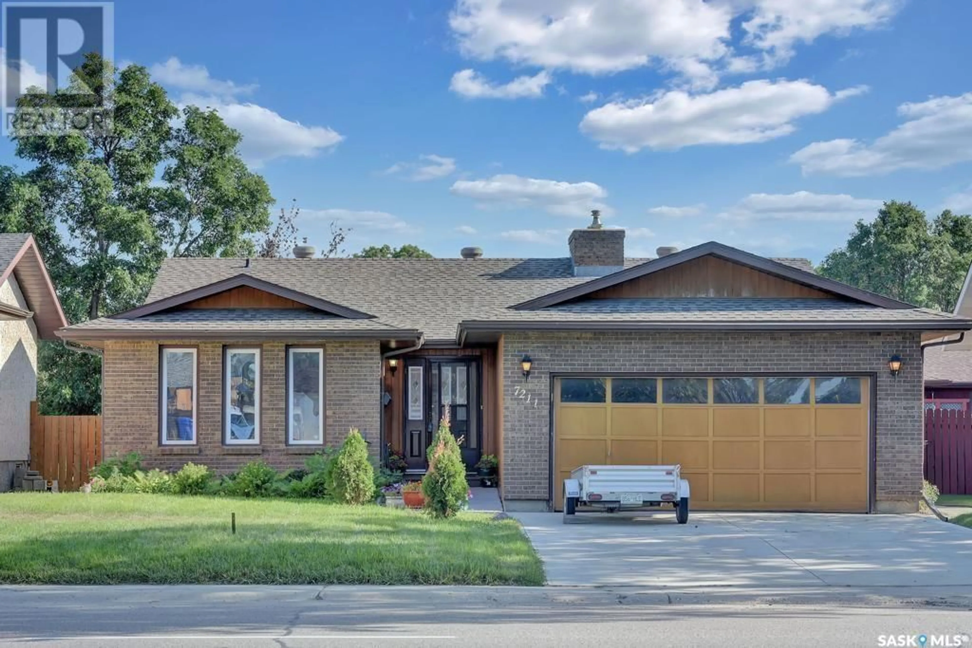 Home with brick exterior material, street for 7211 SHERWOOD DRIVE, Regina Saskatchewan S4X2V5