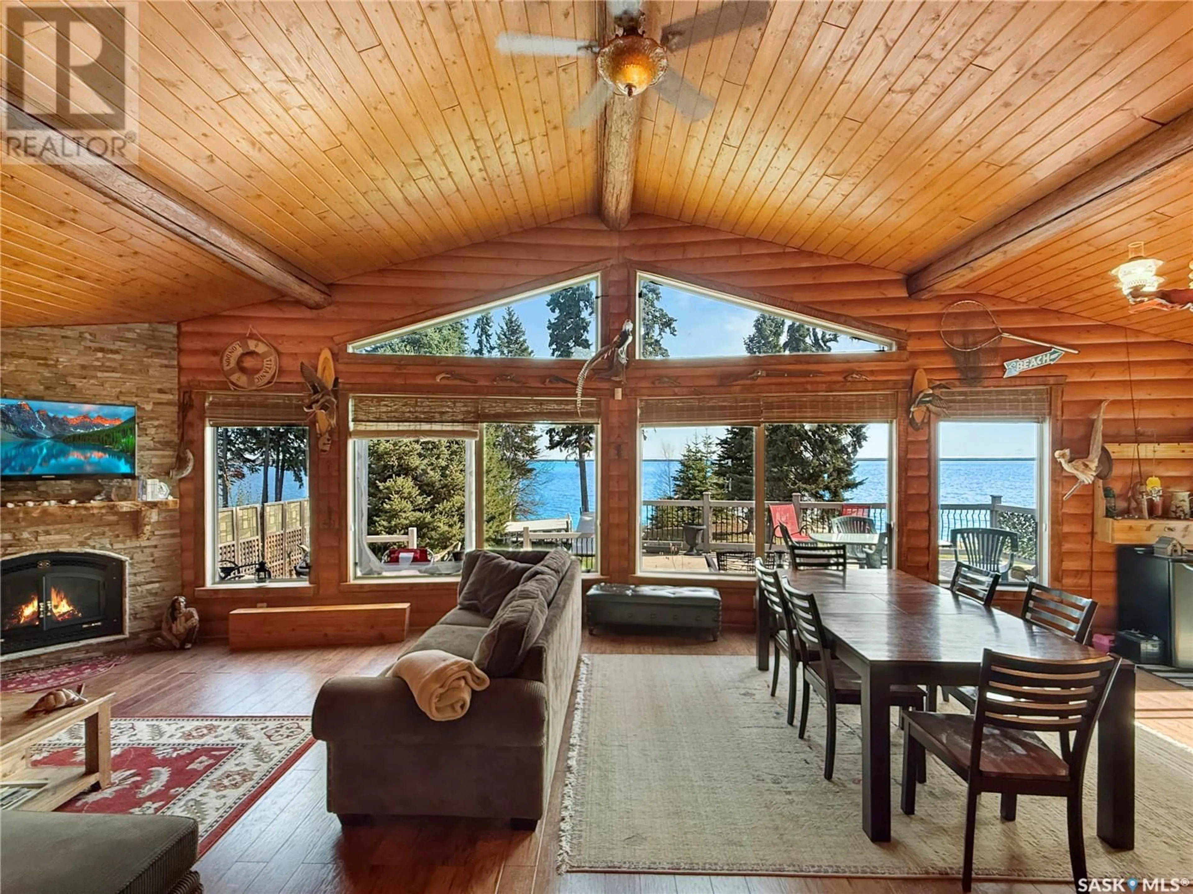 Living room with furniture, wood/laminate floor for 26 CLEARSAND DRIVE, Candle Lake Saskatchewan S0J3E0