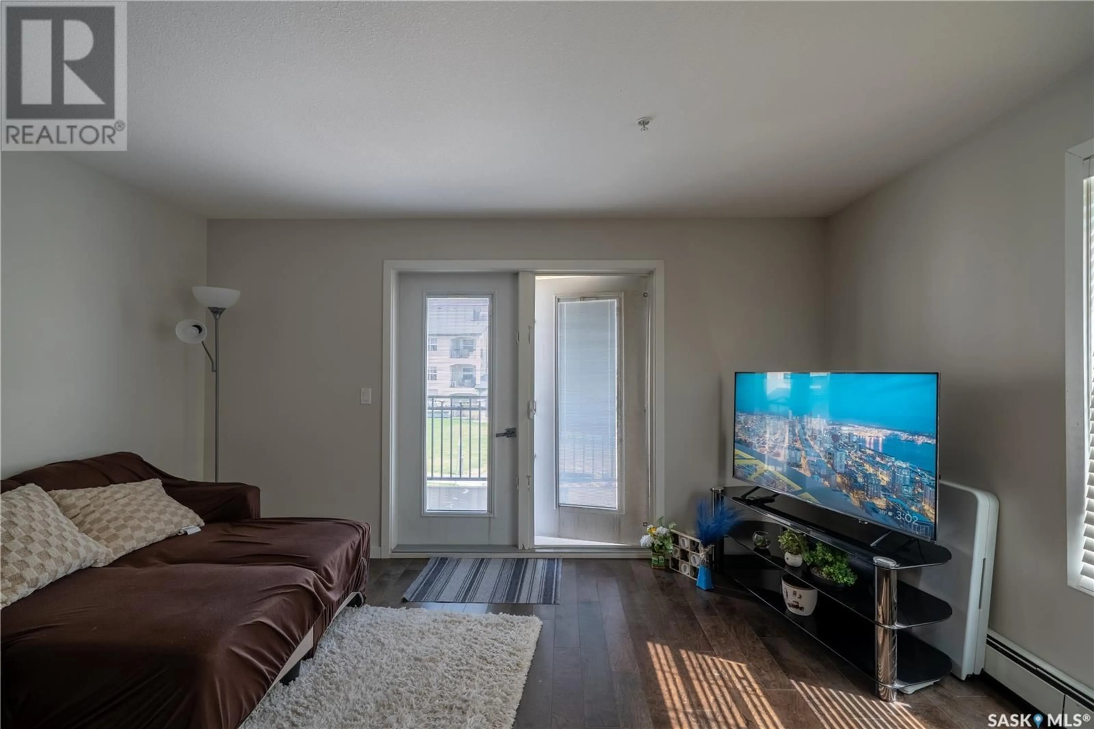 Living room with furniture, wood/laminate floor for 220 1545 NEVILLE DRIVE, Regina Saskatchewan S4Z0A7