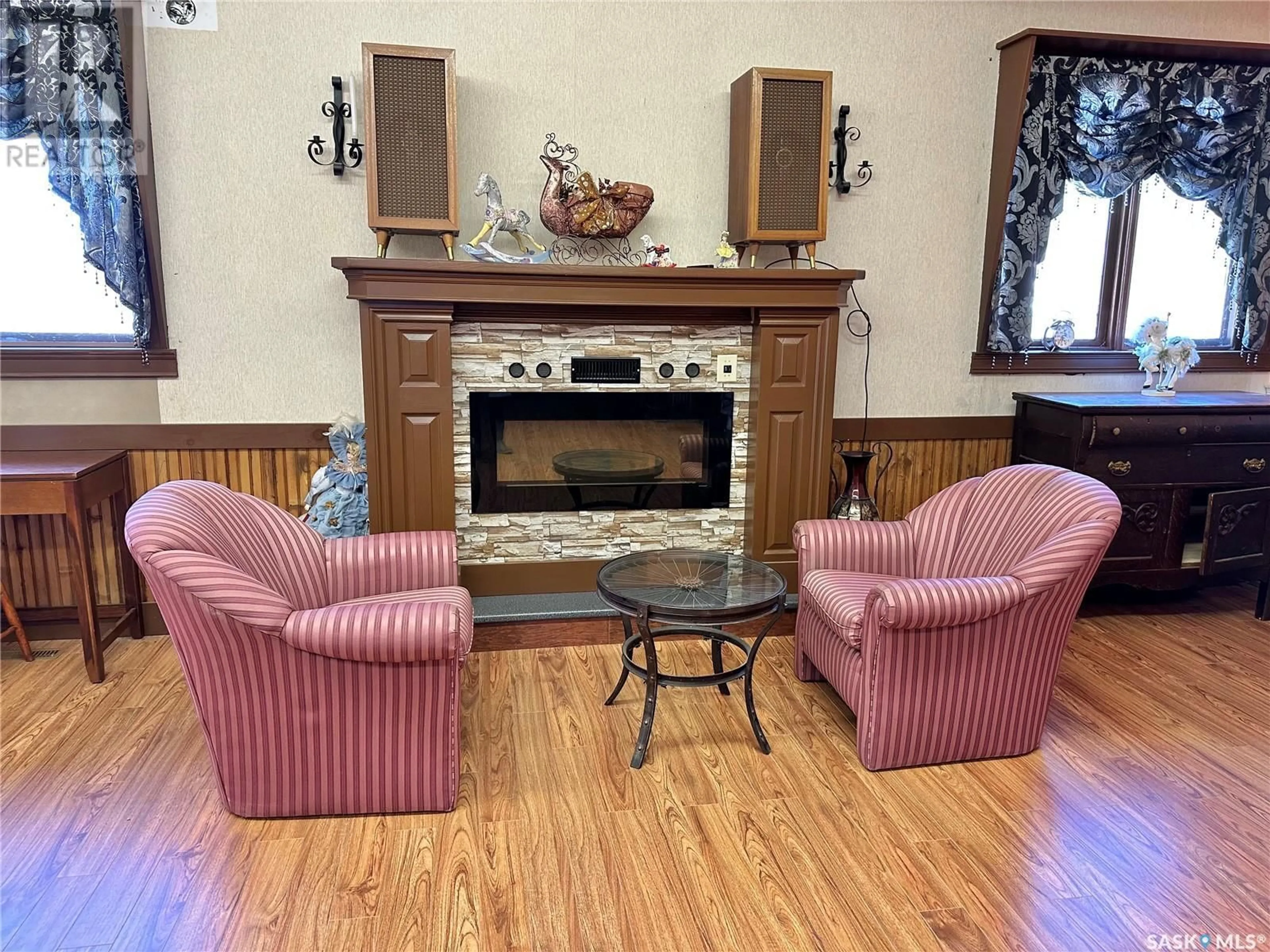 Living room with furniture, wood/laminate floor for 102 1ST AVENUE, Marcelin Saskatchewan S0J1R0