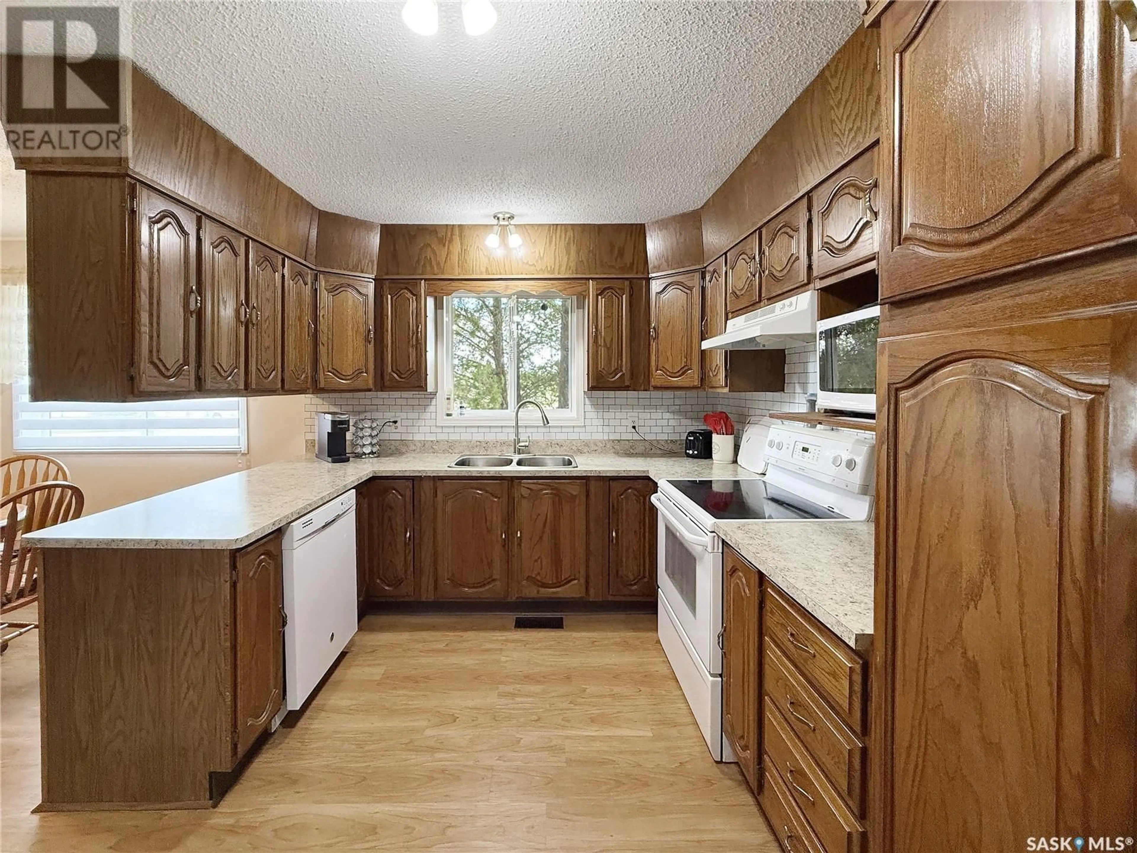 Standard kitchen, wood/laminate floor for 102 2ND STREET, Meath Park Saskatchewan S0J1T0