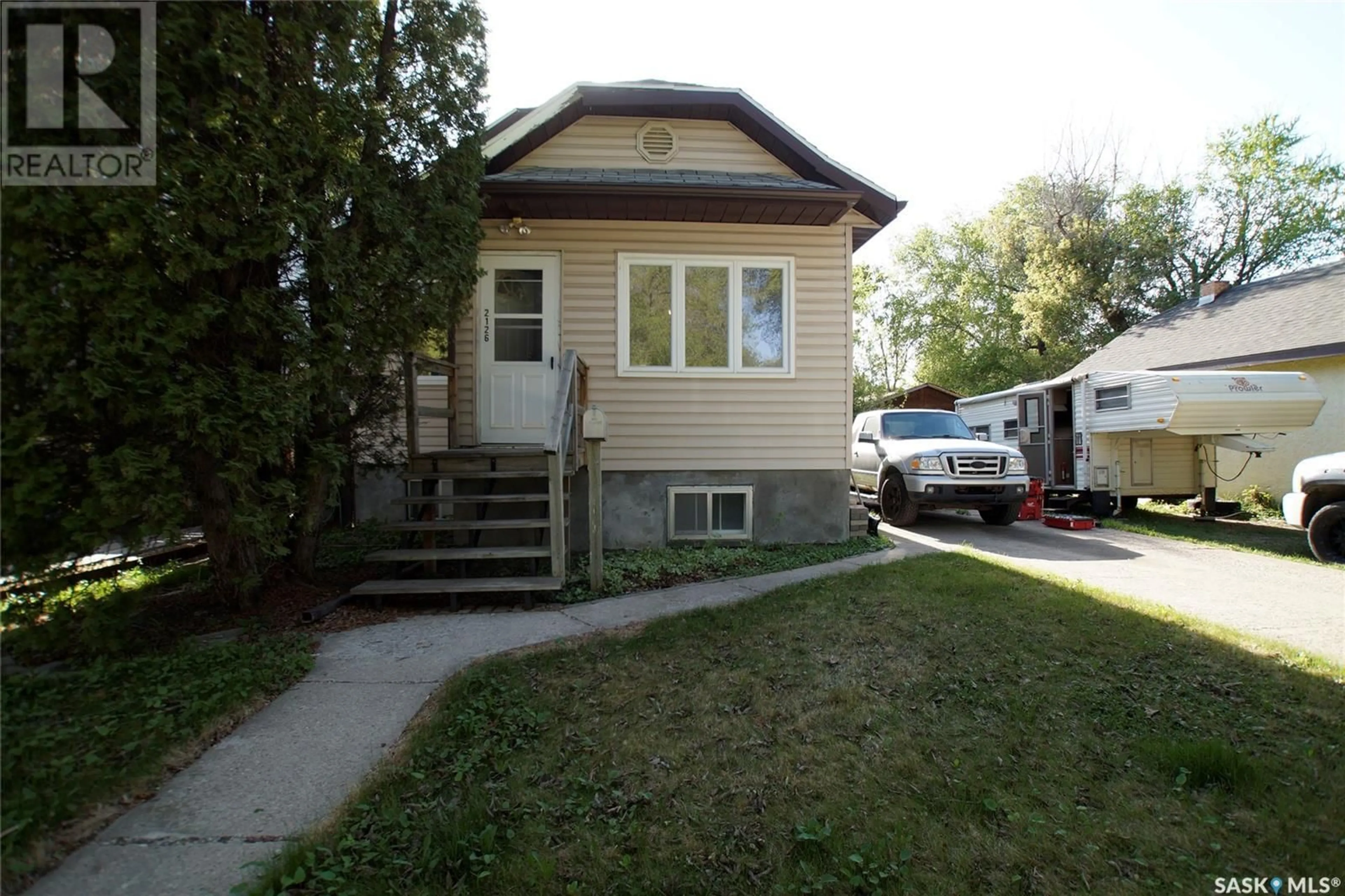 Home with vinyl exterior material, street for 2126 COY AVENUE, Saskatoon Saskatchewan S7M0J2