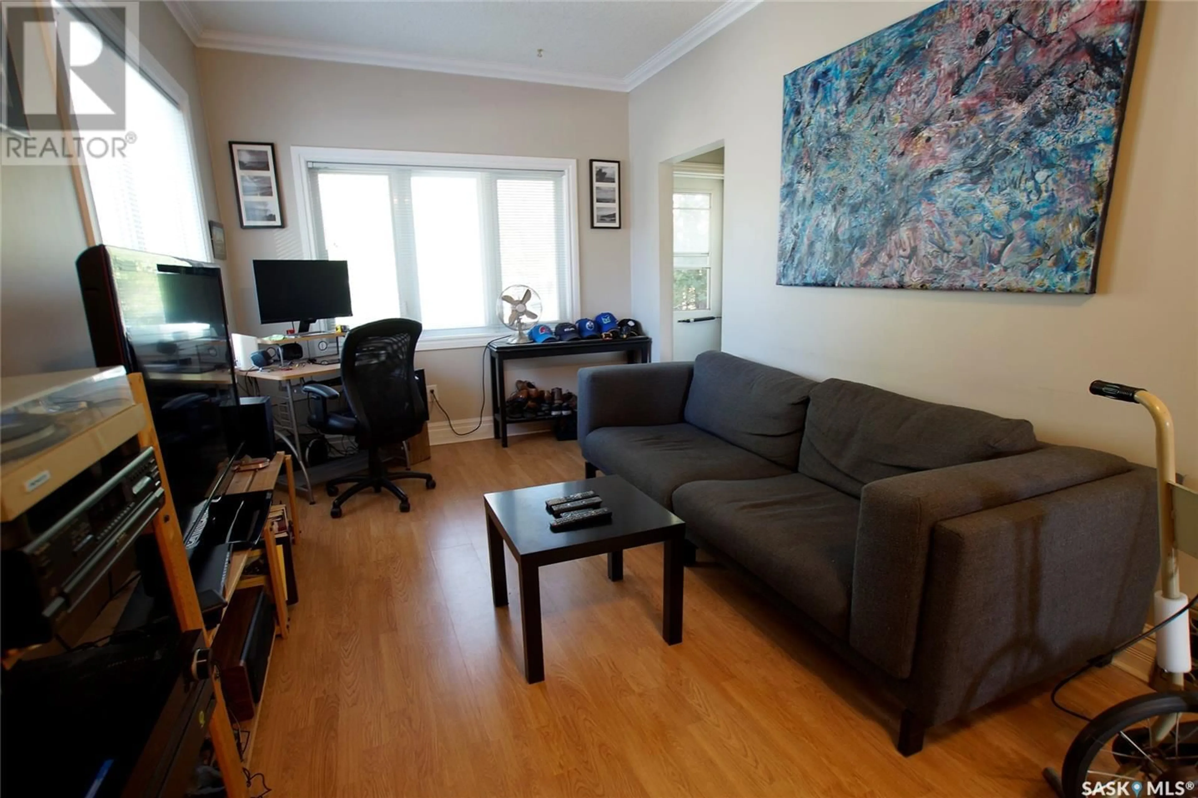 Living room with furniture, wood/laminate floor for 2126 COY AVENUE, Saskatoon Saskatchewan S7M0J2