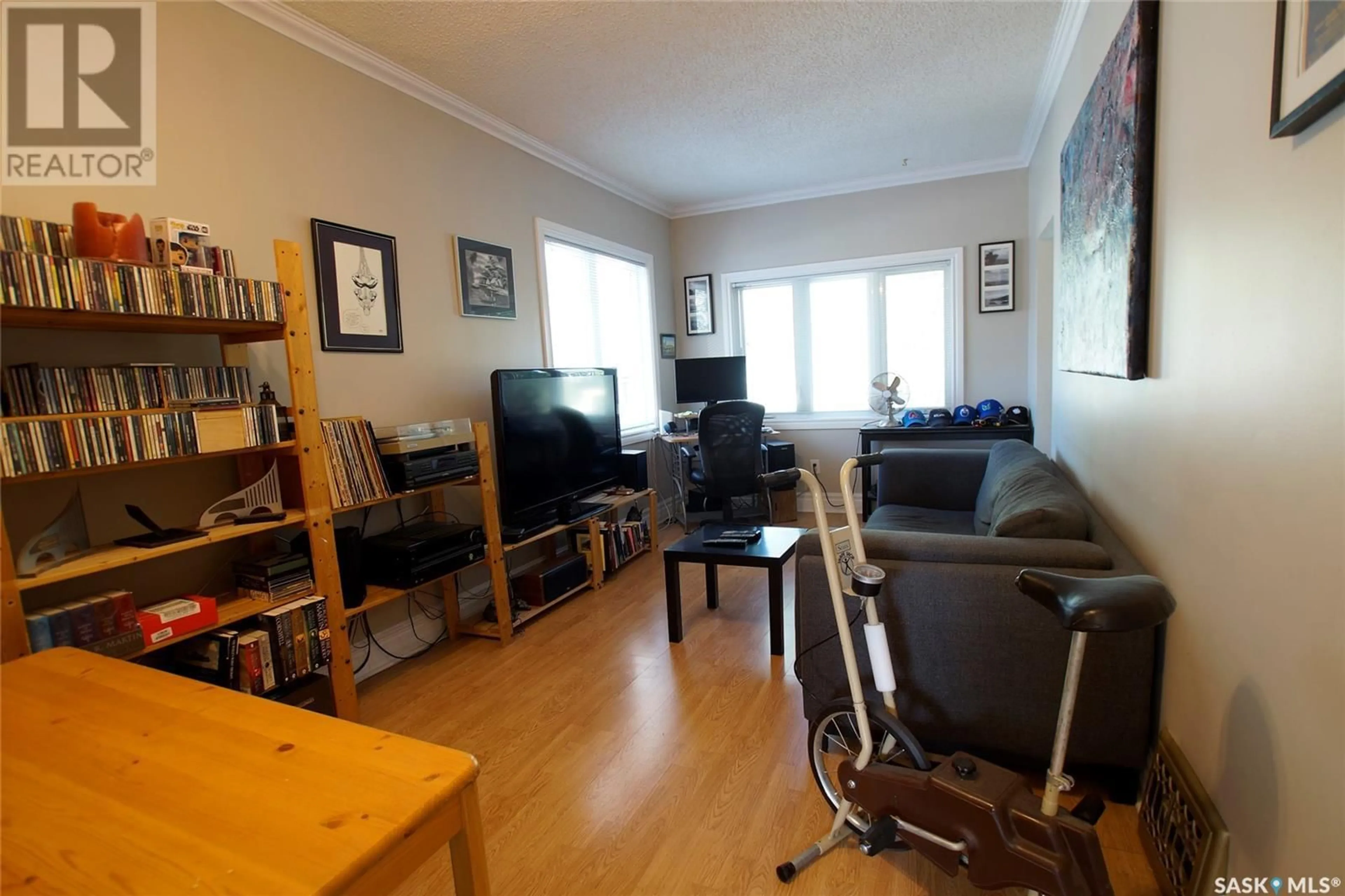 Living room with furniture, wood/laminate floor for 2126 COY AVENUE, Saskatoon Saskatchewan S7M0J2
