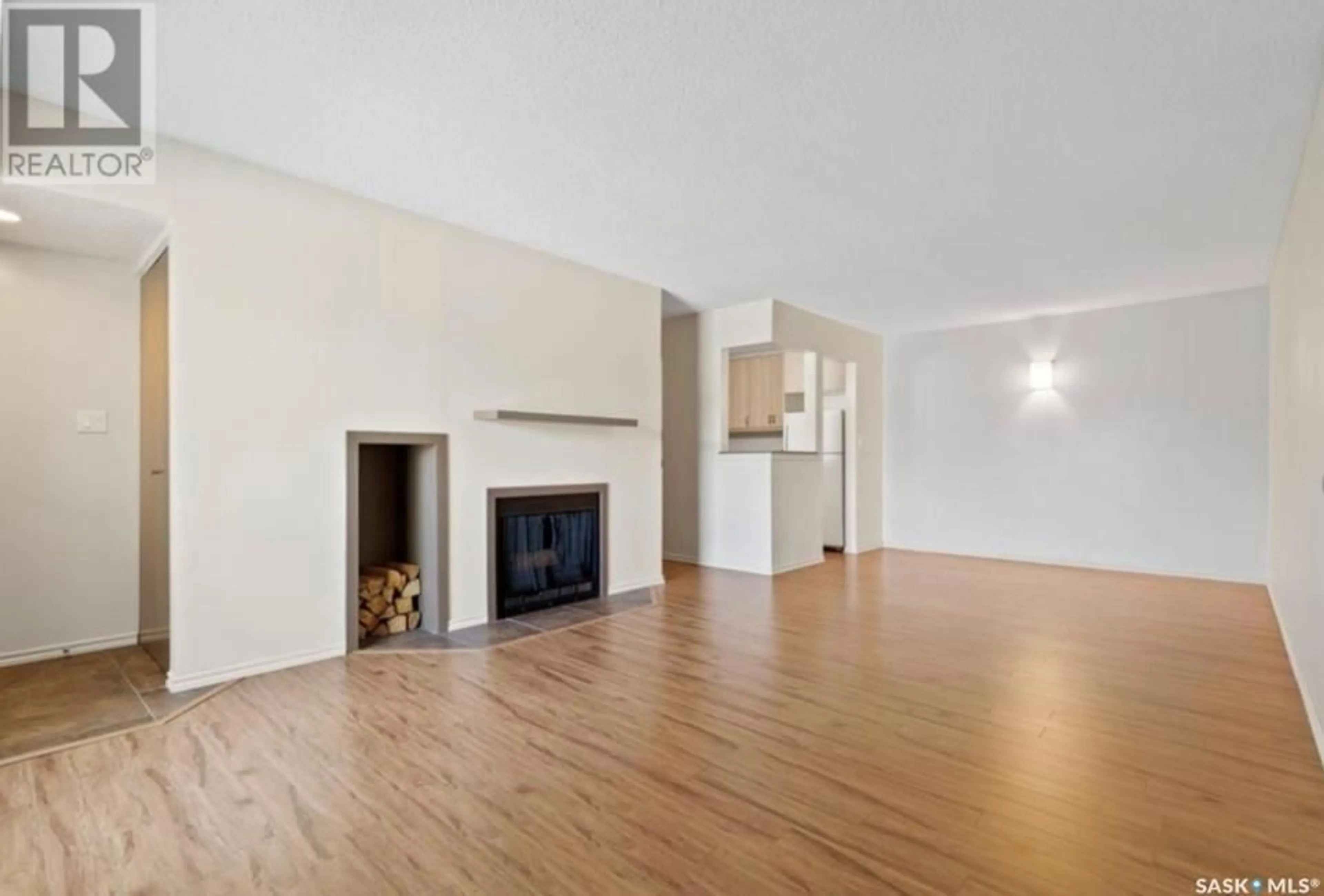 Living room with furniture, wood/laminate floor for 206 GORE PLACE, Regina Saskatchewan S4T7S4