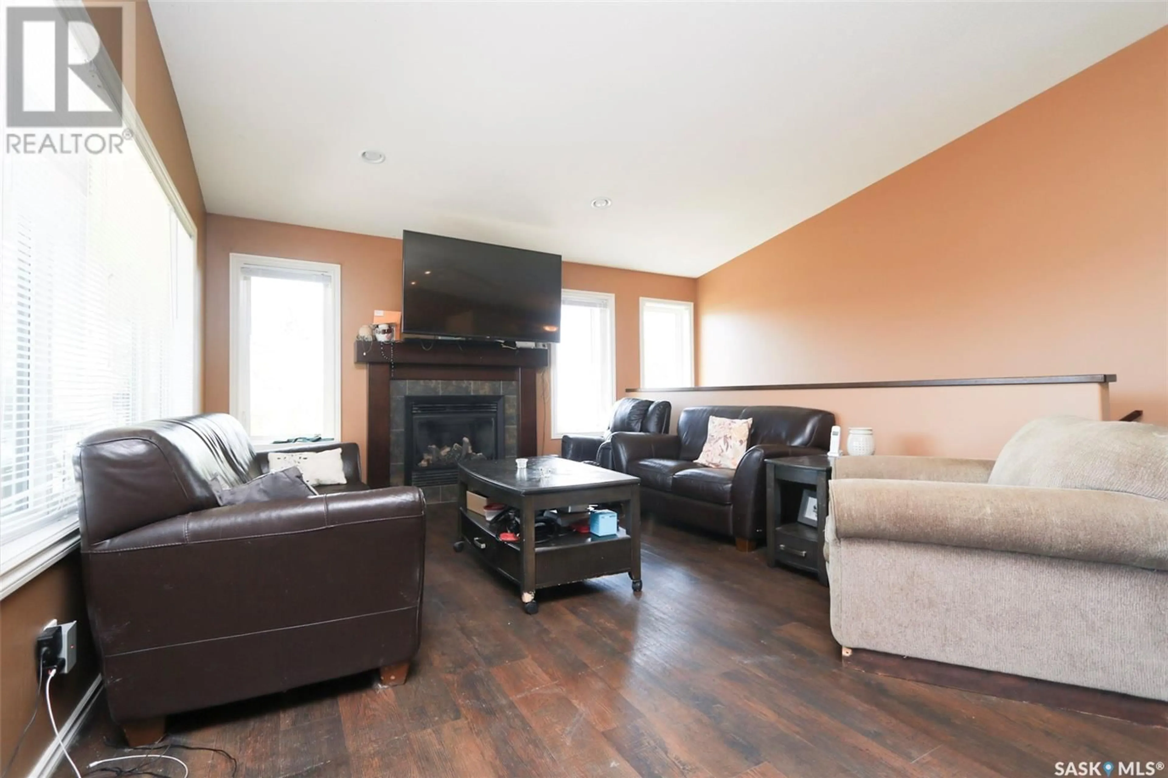 Living room with furniture, wood/laminate floor for 311 DRUMMOND AVENUE, Orkney Rm No. 244 Saskatchewan S3N2V6