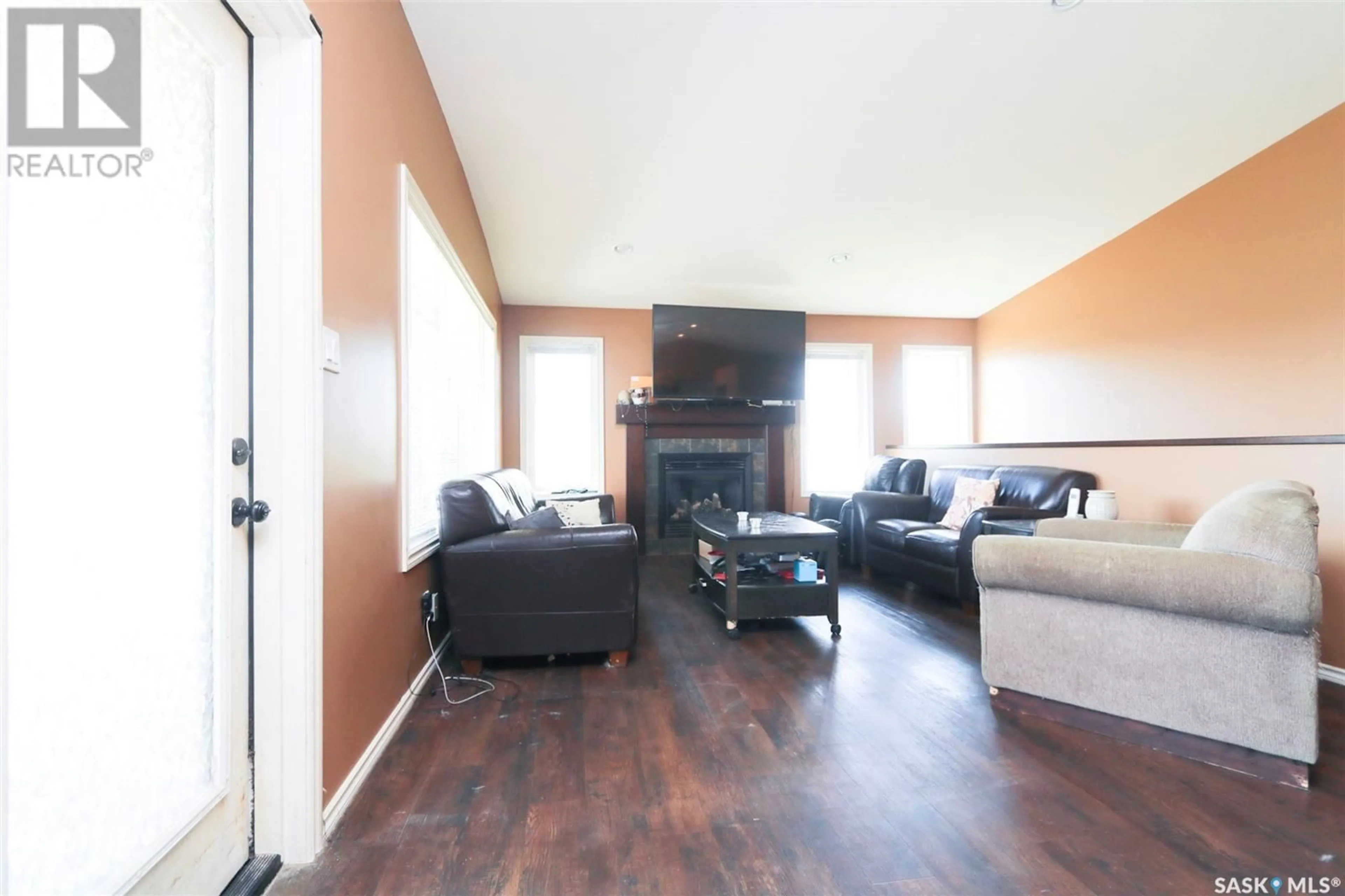 Living room with furniture, wood/laminate floor for 311 DRUMMOND AVENUE, Orkney Rm No. 244 Saskatchewan S3N2V6