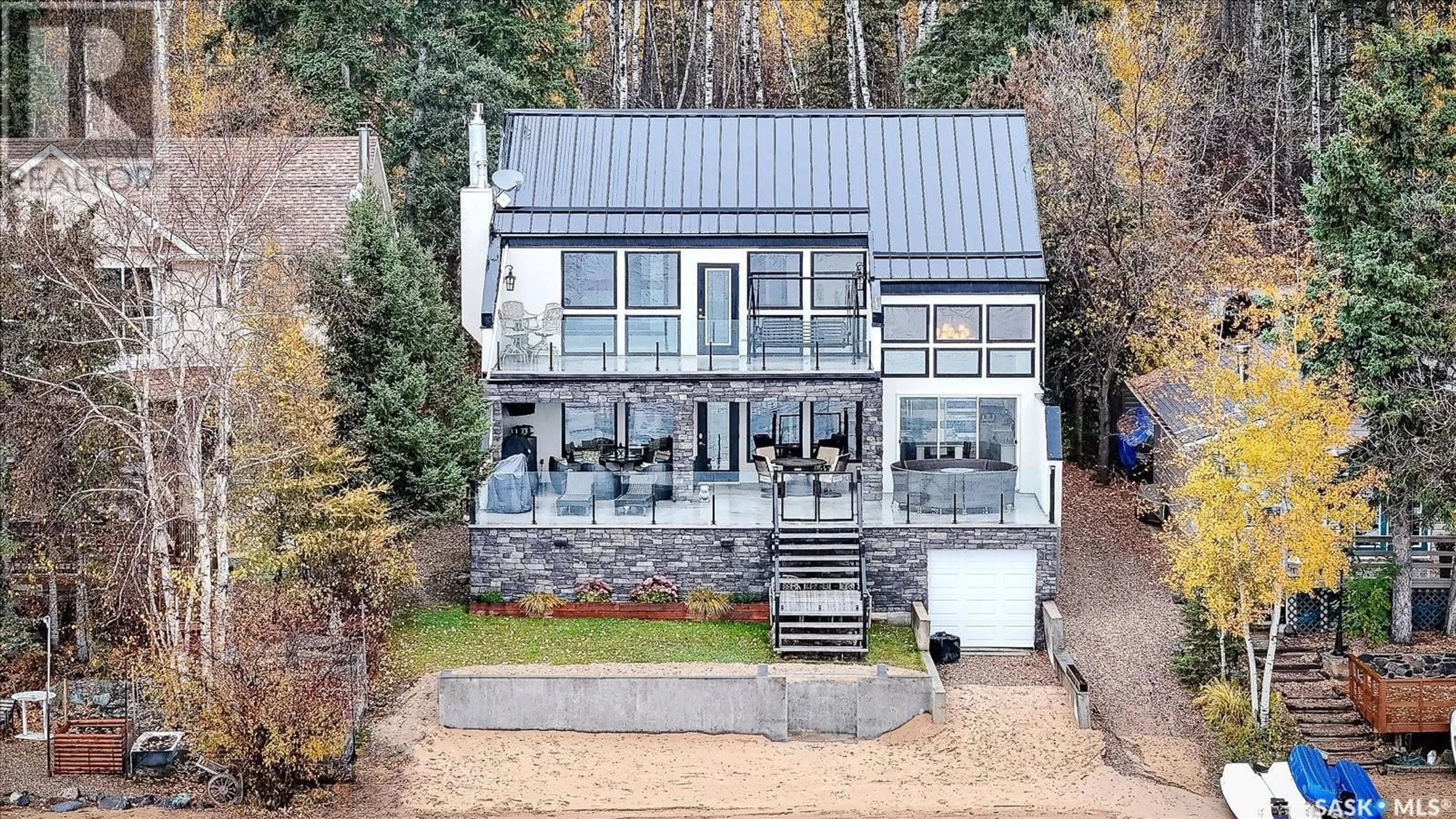 A pic from outside/outdoor area/front of a property/back of a property/a pic from drone, building for 330 NEIS BEACH, Emma Lake Saskatchewan S0J0N0