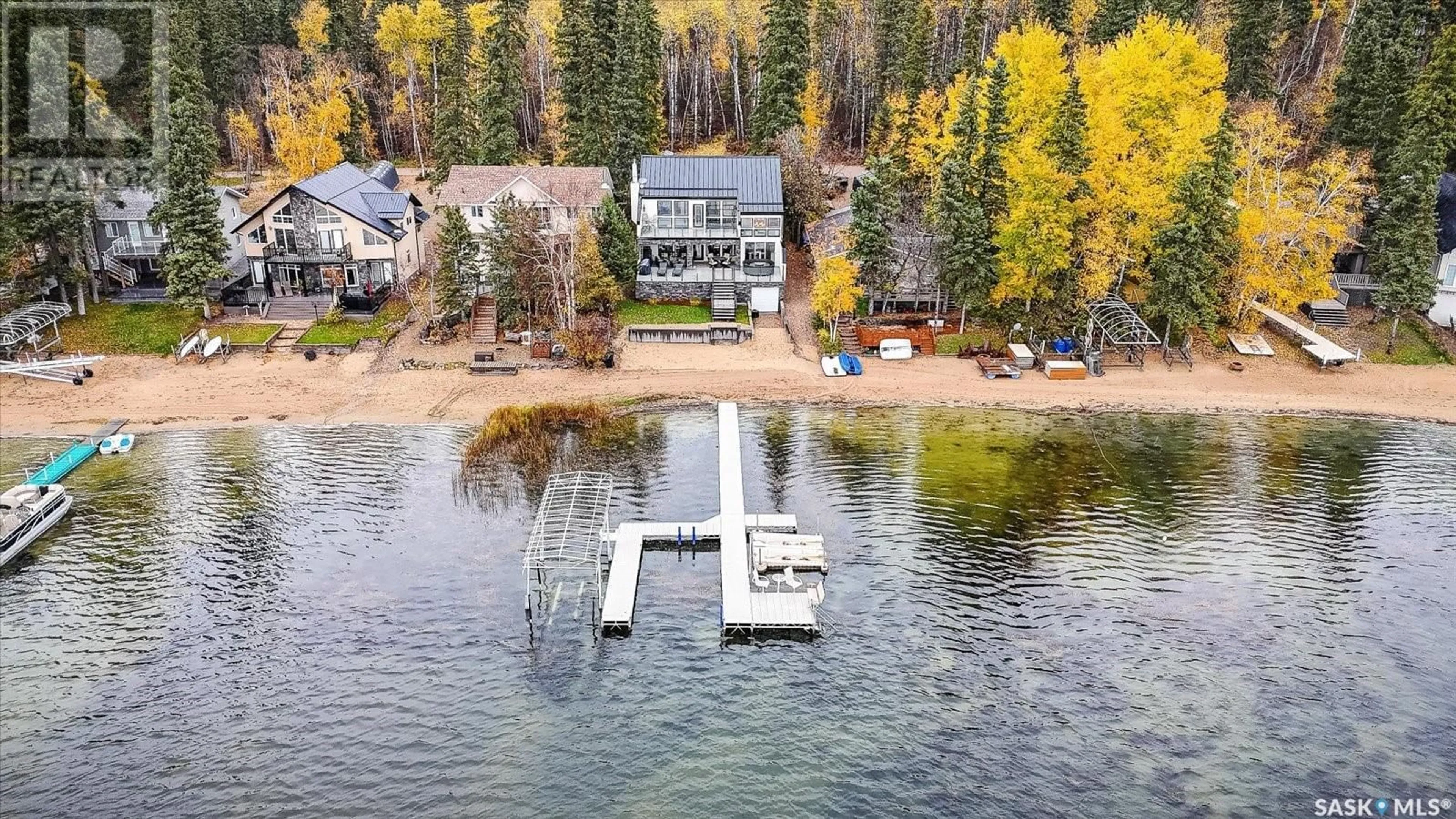 A pic from outside/outdoor area/front of a property/back of a property/a pic from drone, water/lake/river/ocean view for 330 NEIS BEACH, Emma Lake Saskatchewan S0J0N0