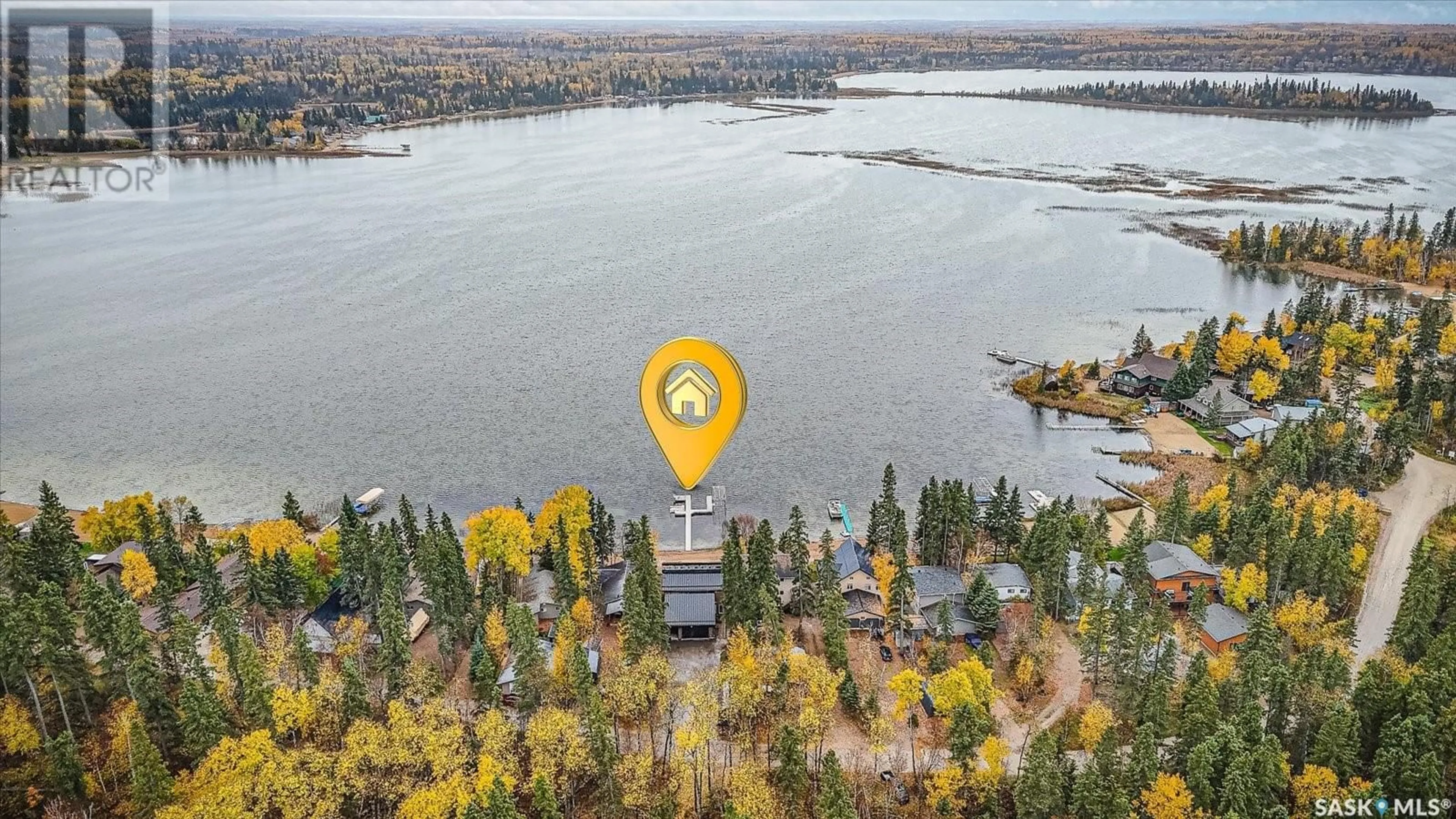 A pic from outside/outdoor area/front of a property/back of a property/a pic from drone, water/lake/river/ocean view for 330 NEIS BEACH, Emma Lake Saskatchewan S0J0N0