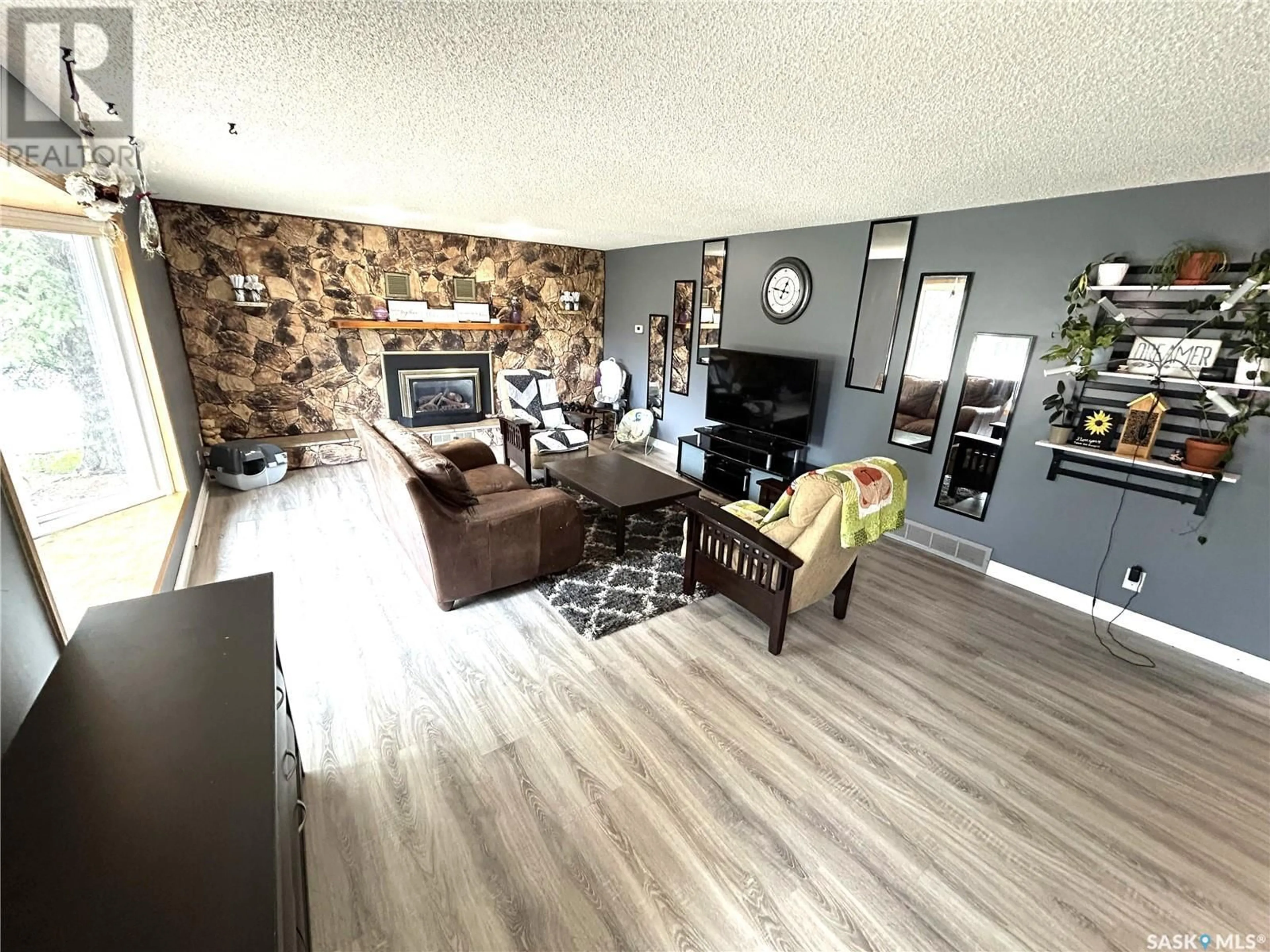Living room with furniture, wood/laminate floor for 356 EASTVIEW STREET, Burstall Saskatchewan S0N0H0