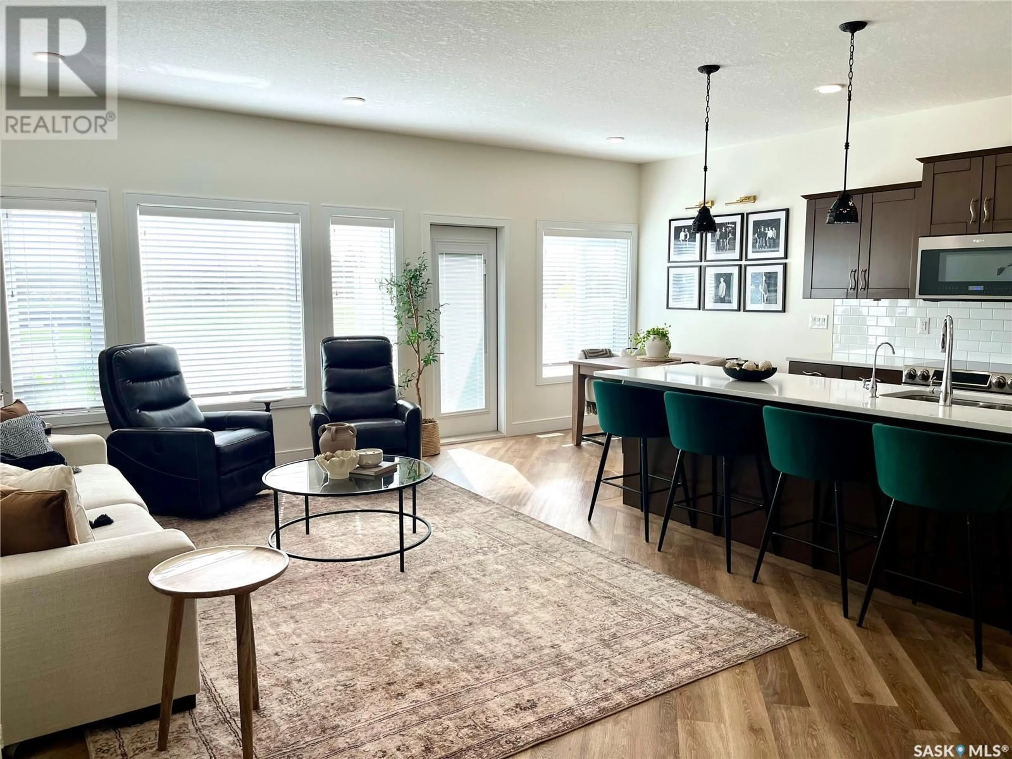Open concept kitchen, wood/laminate floor for 7 2221 SASKATCHEWAN DRIVE, Swift Current Saskatchewan S9H5N2
