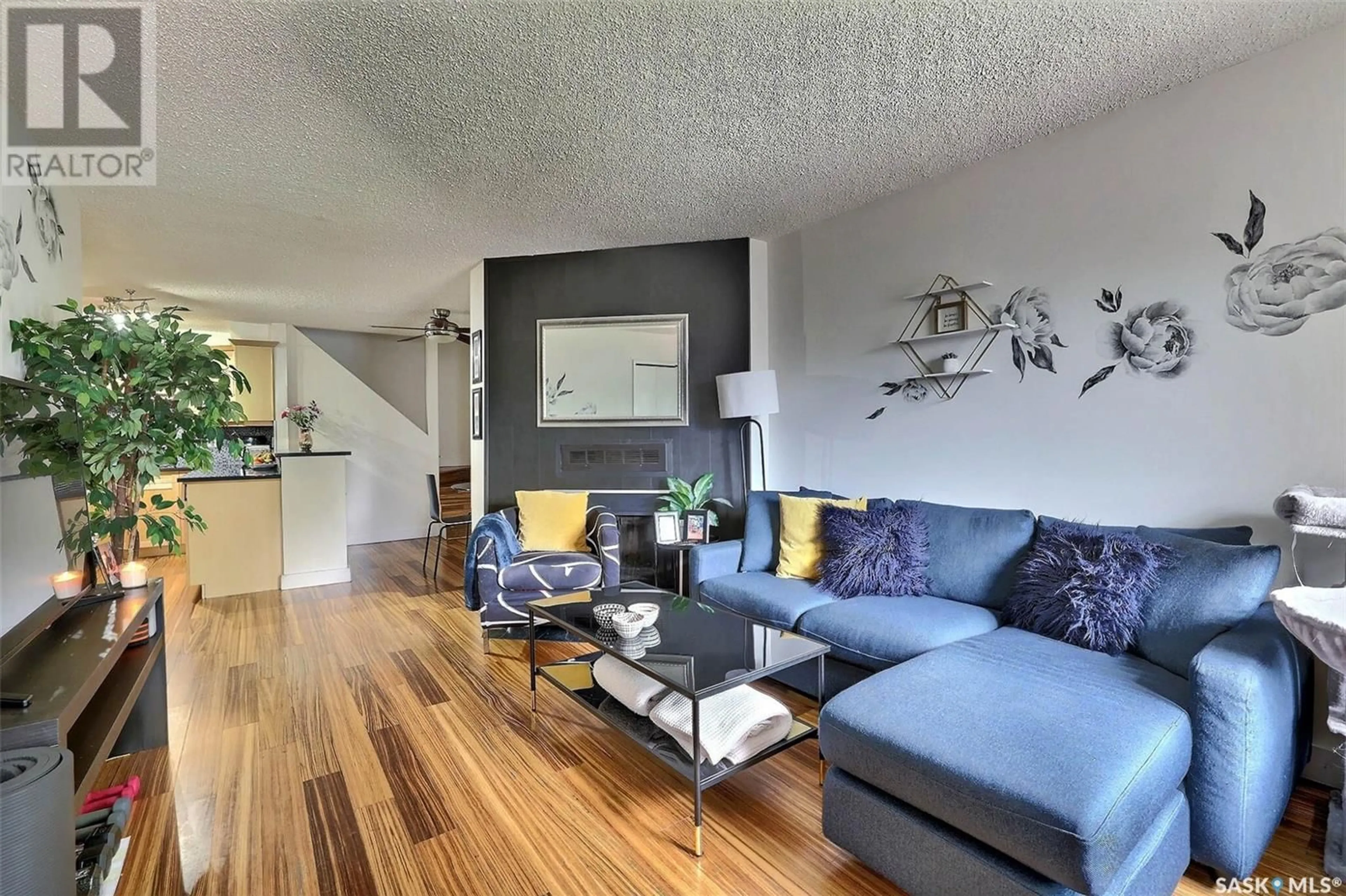 Living room with furniture, wood/laminate floor for 198 CEDAR MEADOW DRIVE, Regina Saskatchewan S4X3J6