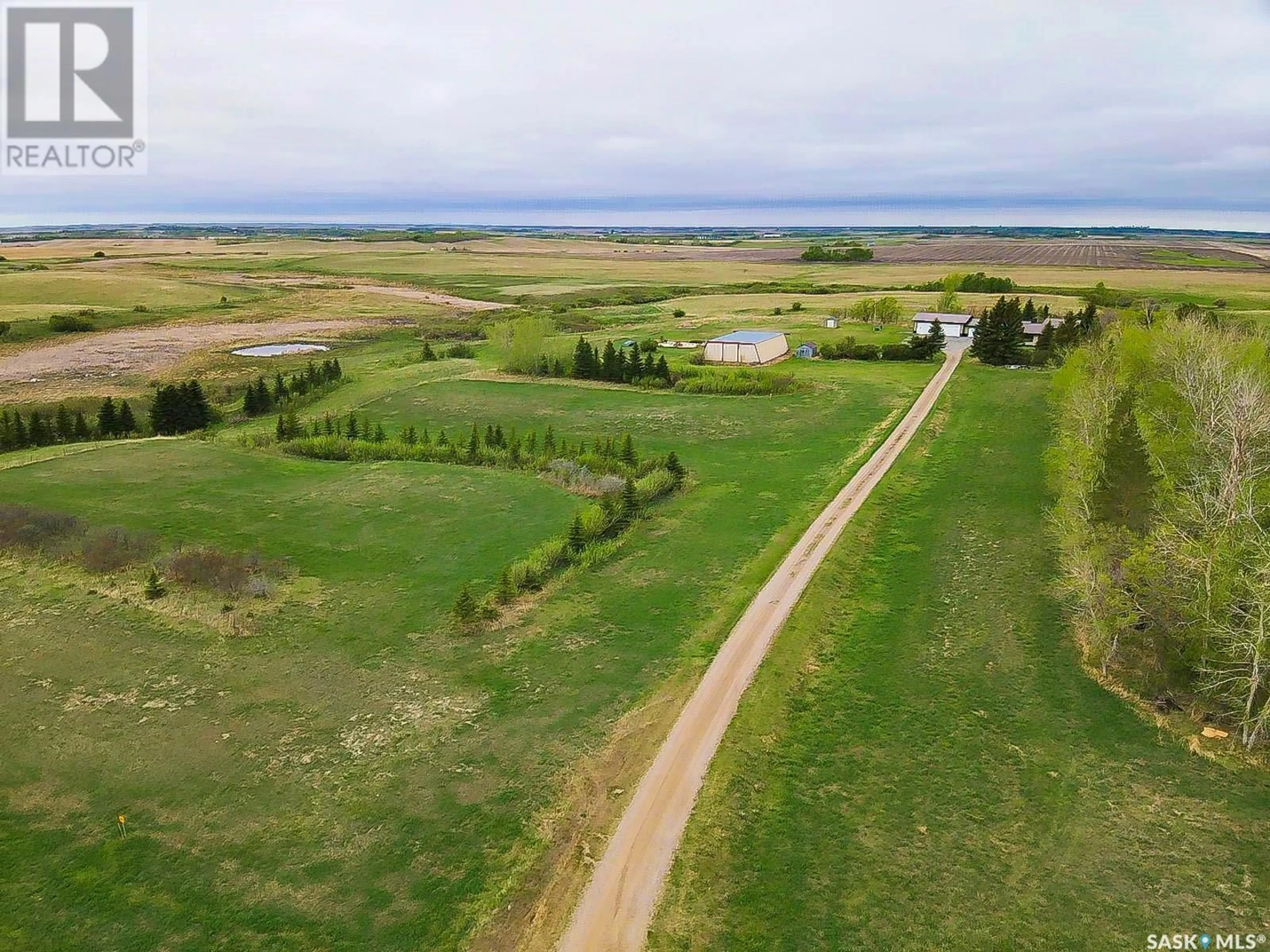 A pic from outside/outdoor area/front of a property/back of a property/a pic from drone, water/lake/river/ocean view for CREEK VIEW ACREAGE, Edenwold Rm No. 158 Saskatchewan S4L5B1