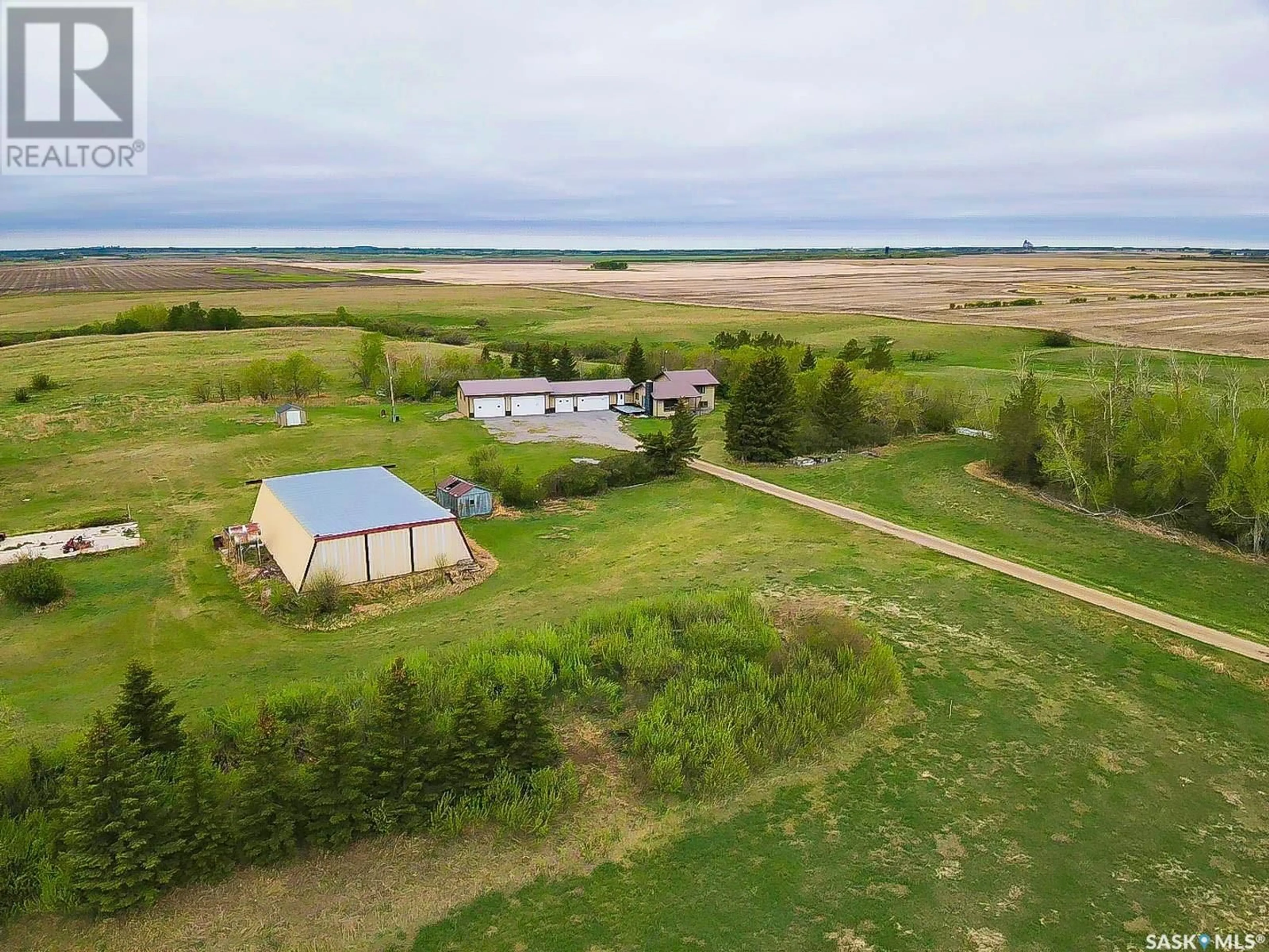 A pic from outside/outdoor area/front of a property/back of a property/a pic from drone, water/lake/river/ocean view for CREEK VIEW ACREAGE, Edenwold Rm No. 158 Saskatchewan S4L5B1