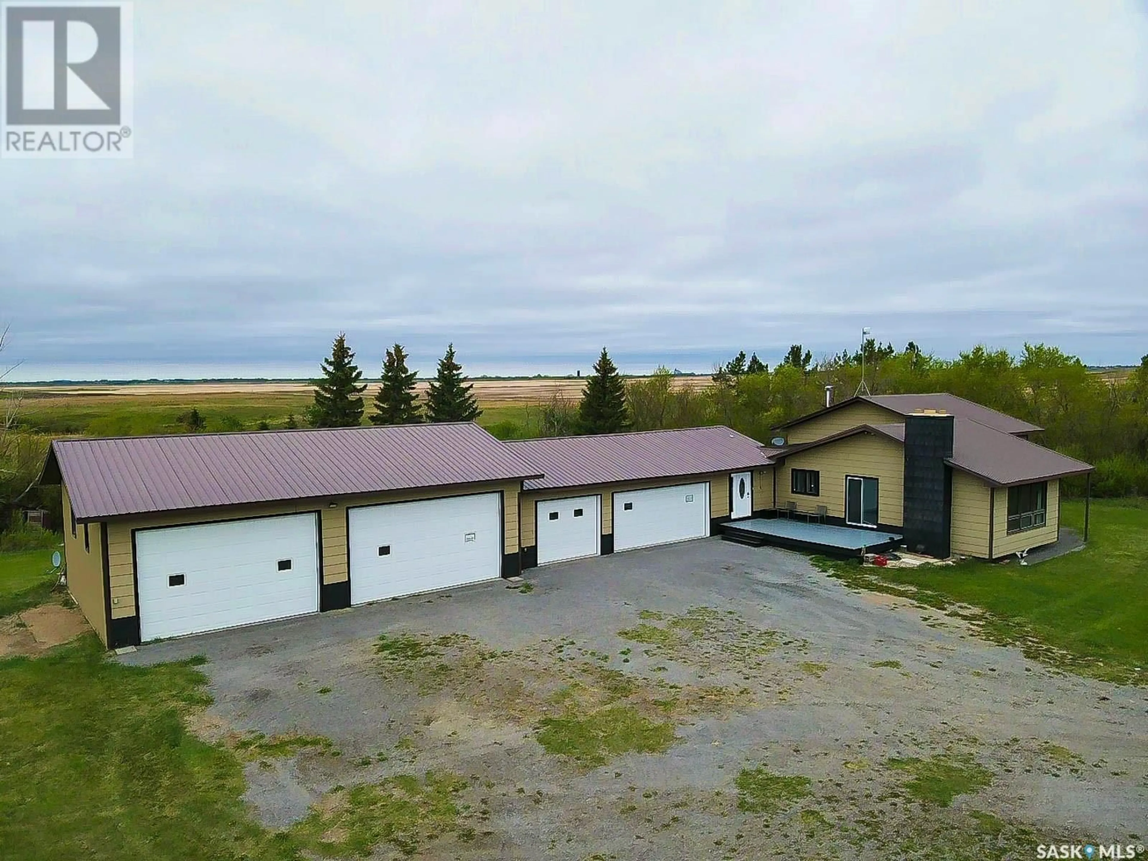 A pic from outside/outdoor area/front of a property/back of a property/a pic from drone, building for CREEK VIEW ACREAGE, Edenwold Rm No. 158 Saskatchewan S4L5B1