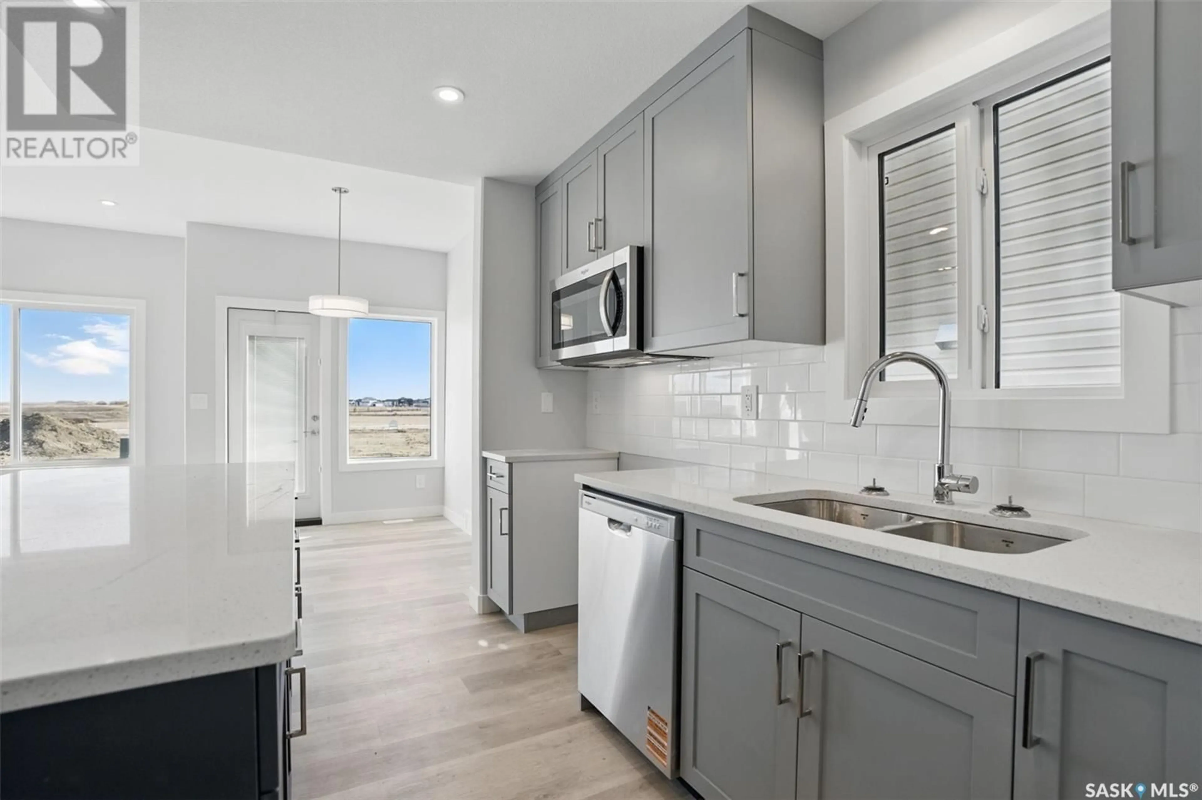 Open concept kitchen, ceramic/tile floor for 242 ANTONINI COURT, Saskatoon Saskatchewan S0K1V0