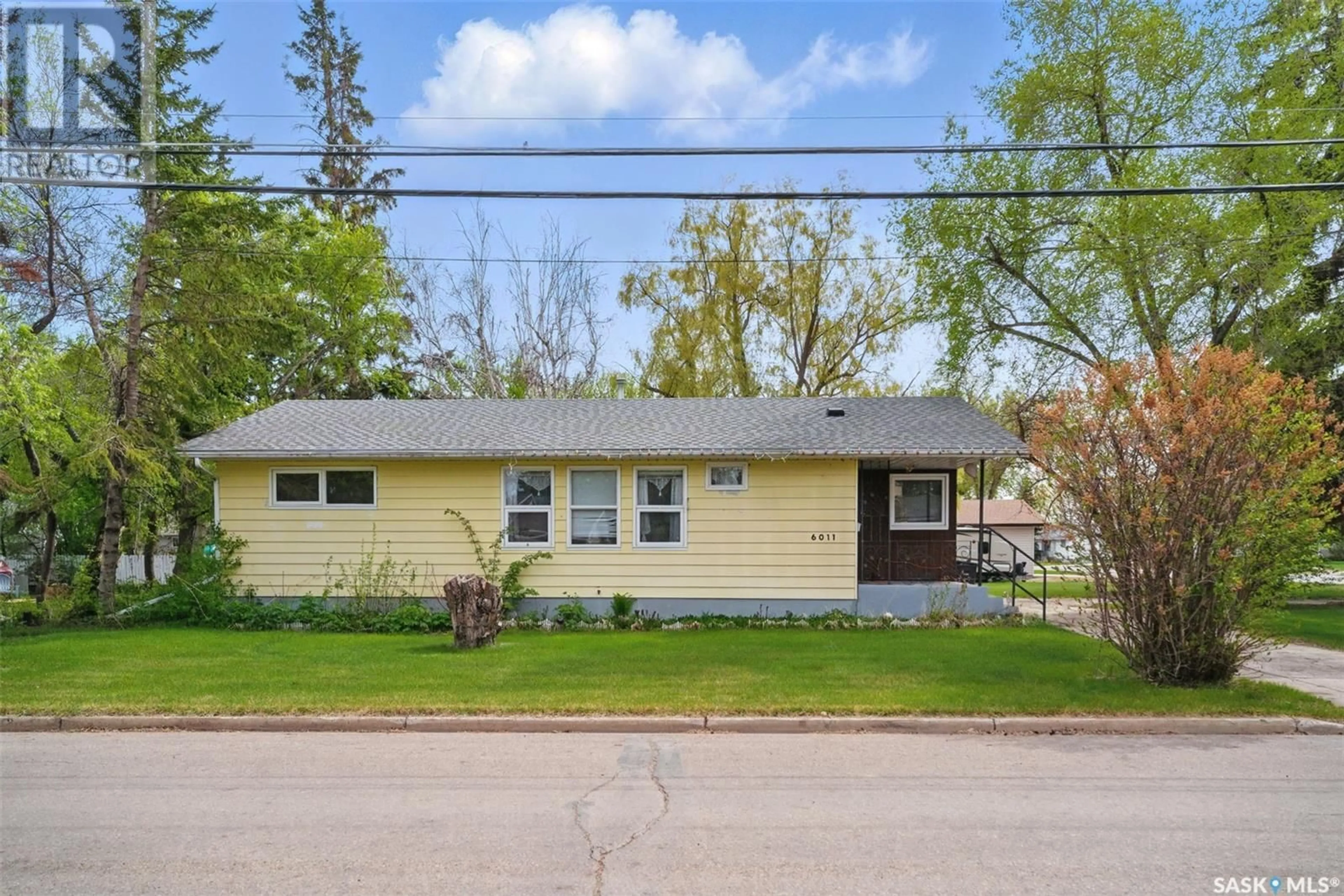 Home with vinyl exterior material, street for 6011 5TH STREET, Rosthern Saskatchewan S0K2H0