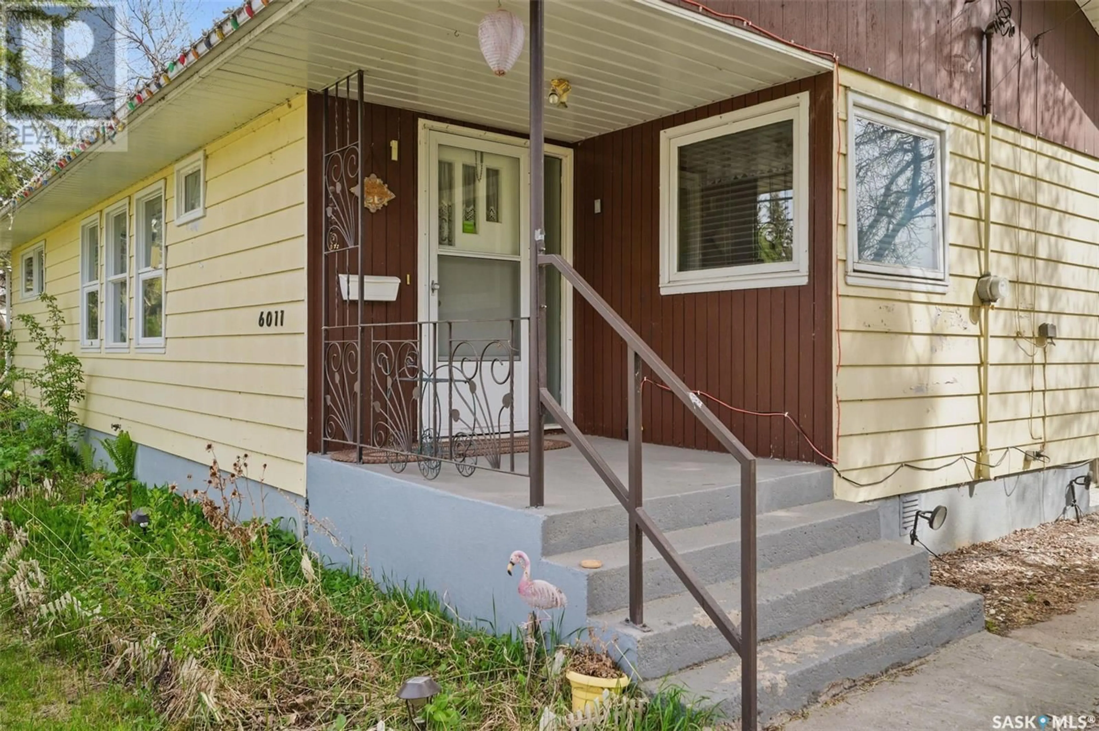 Home with vinyl exterior material, street for 6011 5TH STREET, Rosthern Saskatchewan S0K2H0