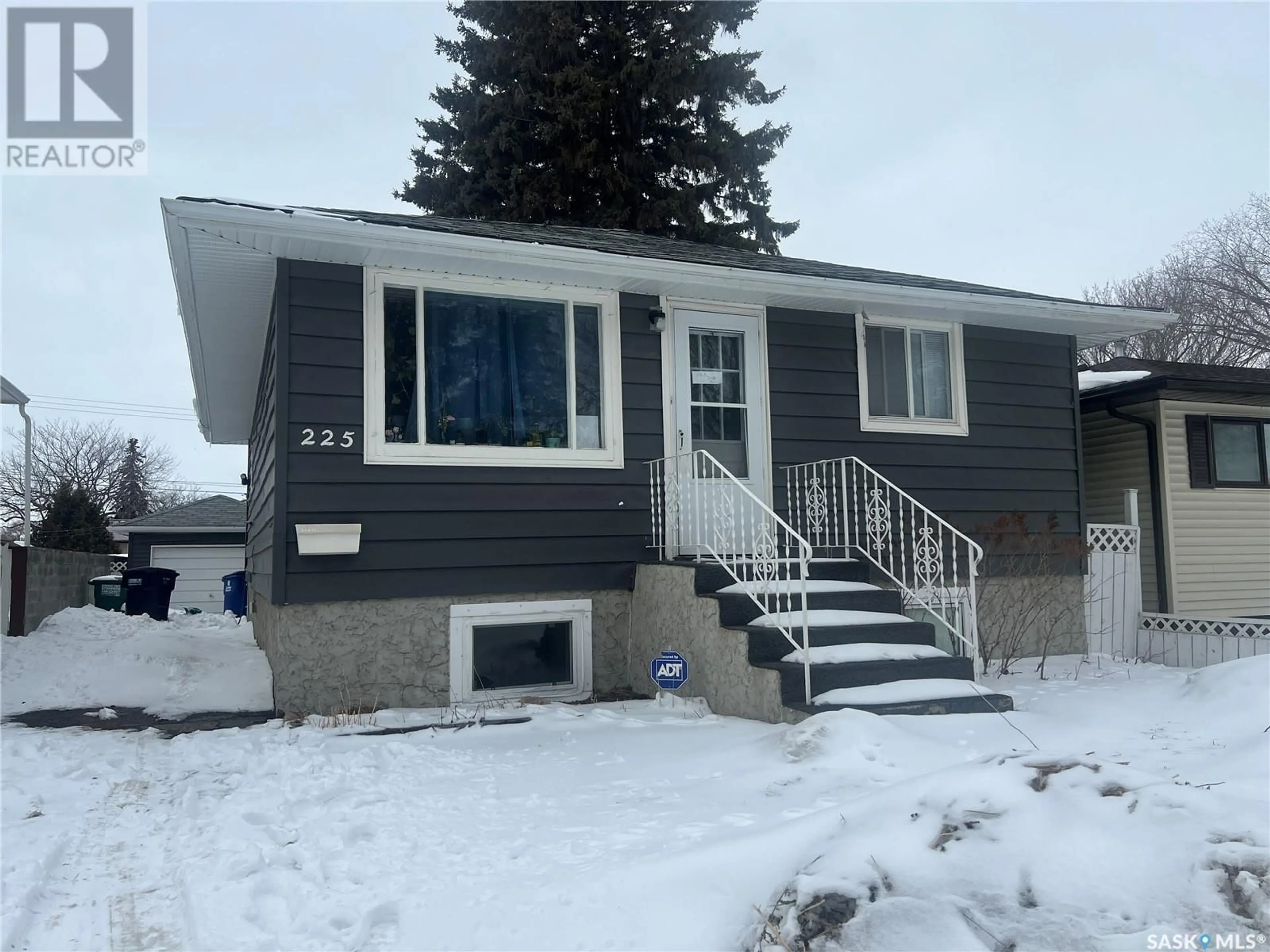 Home with vinyl exterior material, street for 225 OTTAWA AVENUE, Saskatoon Saskatchewan S7M3L4