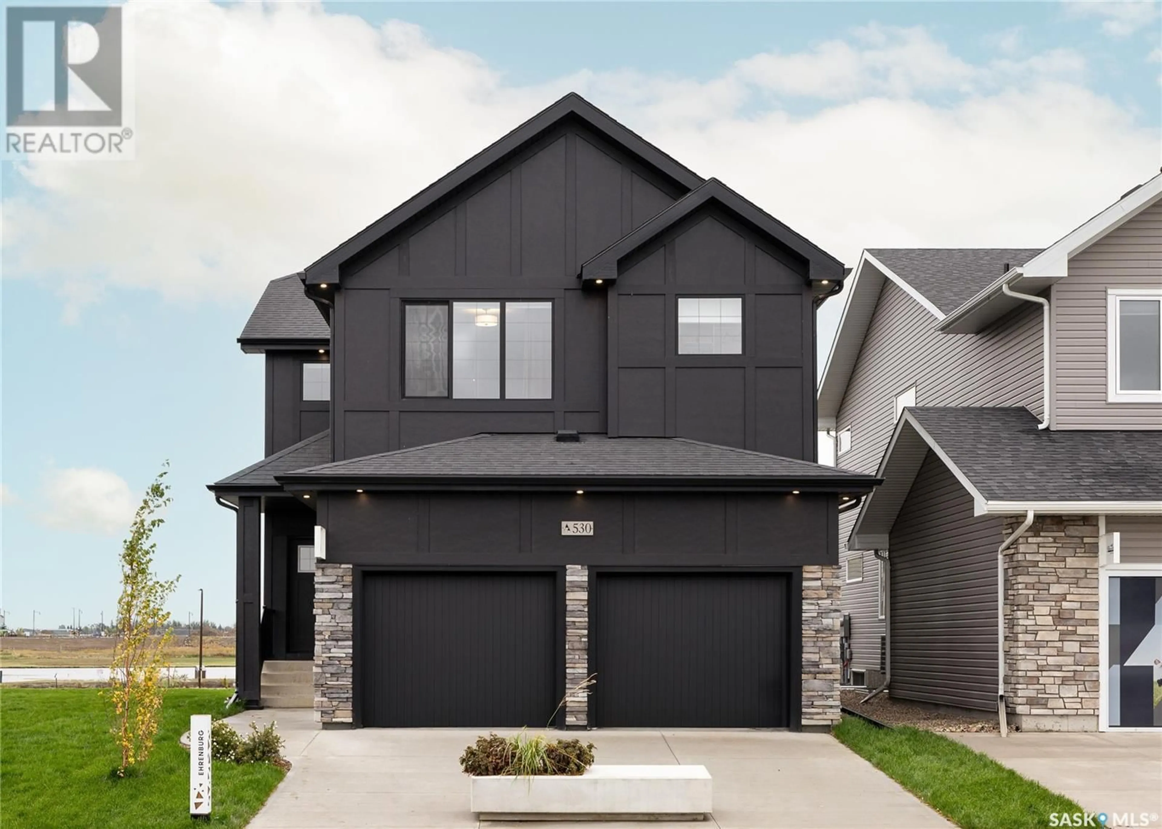 Home with brick exterior material, street for 955 TRAEGER MANOR, Saskatoon Saskatchewan S7V1V8