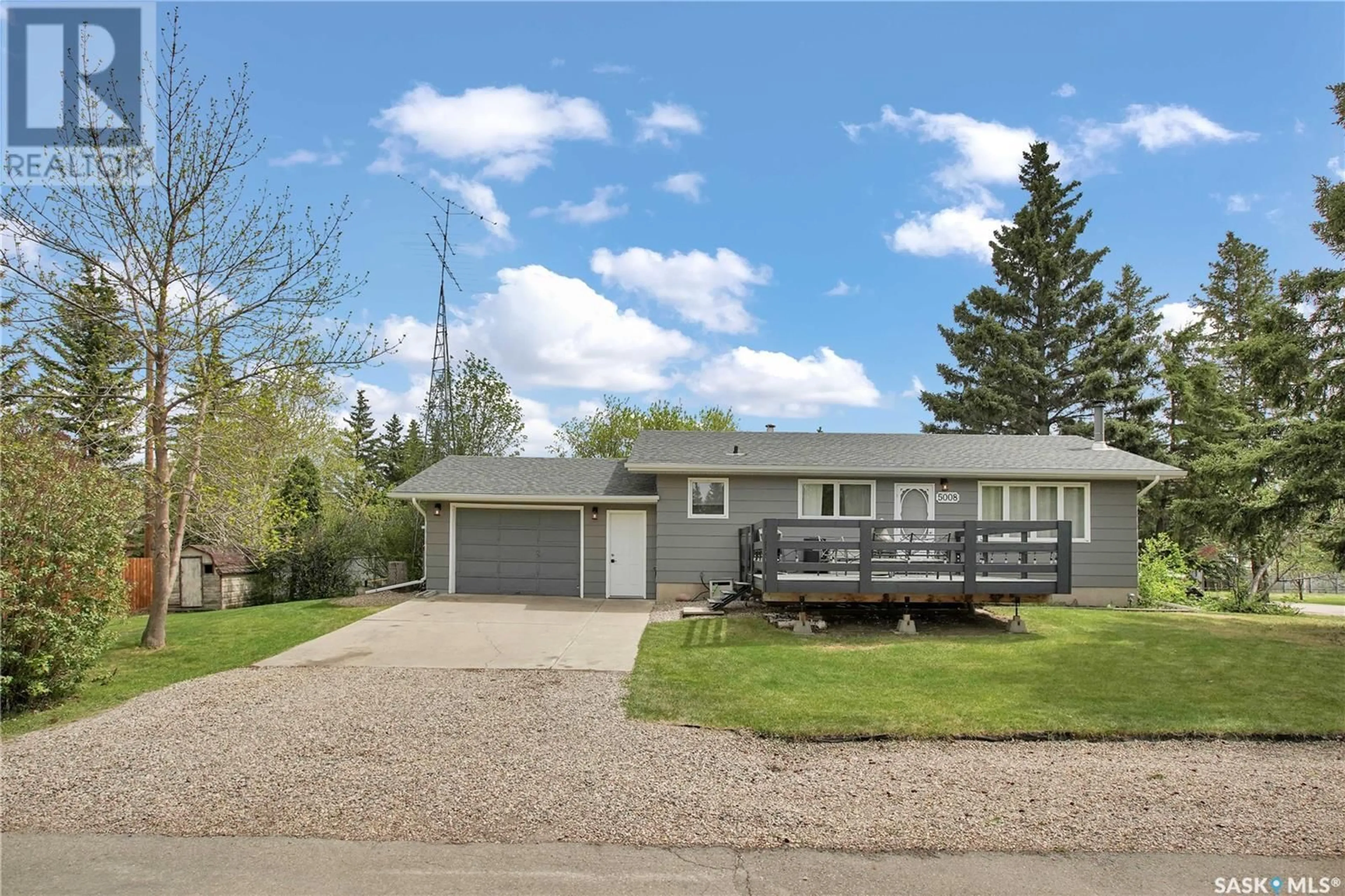 Home with vinyl exterior material, street for 5008 NEUFELD AVENUE, Waldheim Saskatchewan S0K4R0