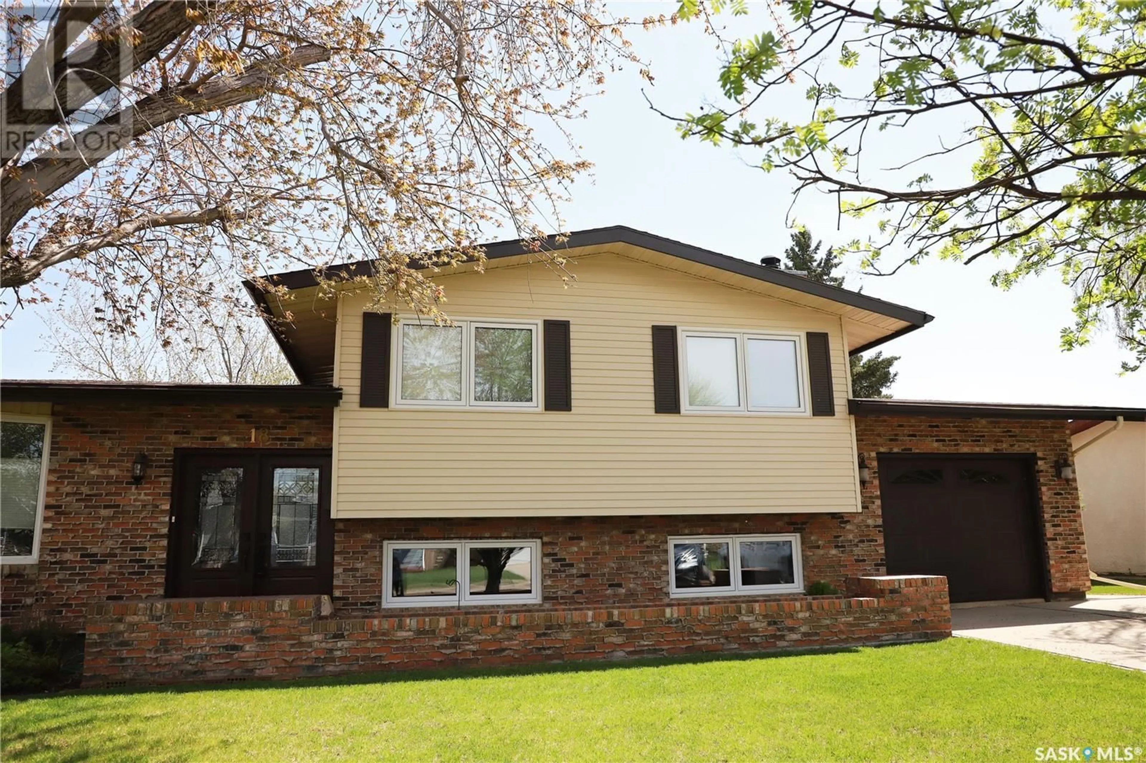 Home with vinyl exterior material, street for 18 VANIER DRIVE, Melville Saskatchewan S0A2P0